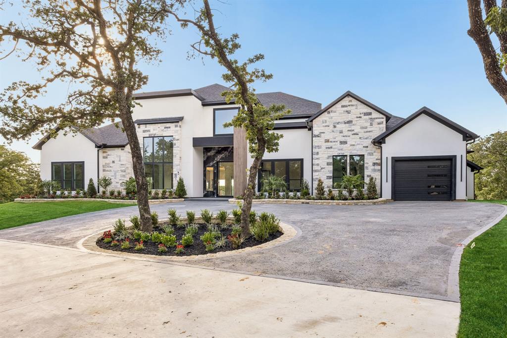 LOCATION. LAKE VIEWS. NATURE PRESERVE. Welcome to 2800 N Kimball, where architectural brilliance meets natural serenity on 2.69 lush acres with breathtaking Grapevine Lake & full access to nature preserve. Over 13,000 Sq Ft under roof this masterpiece showcases 3 and a half levels of unparalleled luxury. An elevator provides seamless access to all three levels.Enter through a grand 10-foot iron and glass pivot door into 26-ft soaring ceilings. The great room boasts a stunning 16-foot bookmatched blue diamond wall with linear fireplace and custom marble accents. Folding glass doors reveal a resort-style oasis with treetop-level infinity edge pool, custom spa with outdoor screens, & interconnected climate control throughout. The culinary kitchen features a waterfall marble island, 48-in Wolf range, Sub-Zero refrigerator, and Wolf coffee maker, and adjacent scullery with professional appliances. The dining room captivates with a glass-encased wine wall beneath 26-ft ceilings, while the sophisticated study displays bookmatched features and black fluted wood accents. The luxurious primary suite offers 12-ft tray ceilings, 48-inch gas fireplace, and spa-inspired ensuite with RARE Brazilian blue agate wall, Hollywood soaking tub, herringbone glass tile & cathedral ceiling. Two custom closets include a reinforced vault room & full laundry suite. A relaxation room with coffee bar opens to private pool cabana.First level presents five ensuite bedrooms. The lower level features entertainment sanctuary with wet bar, ensuite bedroom, flex room, and nine-car collector's garage. Upper level boasts game room, media room, covered balcony with Lake Grapevine views, and turfed rooftop with epic panoramic vistas stretching to the horizon. NO HOA. Carroll ISD. Estimated completion late Spring of 2026. 1-2 min. drive to boat ramp & 10 min drive to DFW airport. For the horse hobbyist, an Equestrian Barn suitable for up to 4 horses awaits you. Hiking trails from barn to the lake.