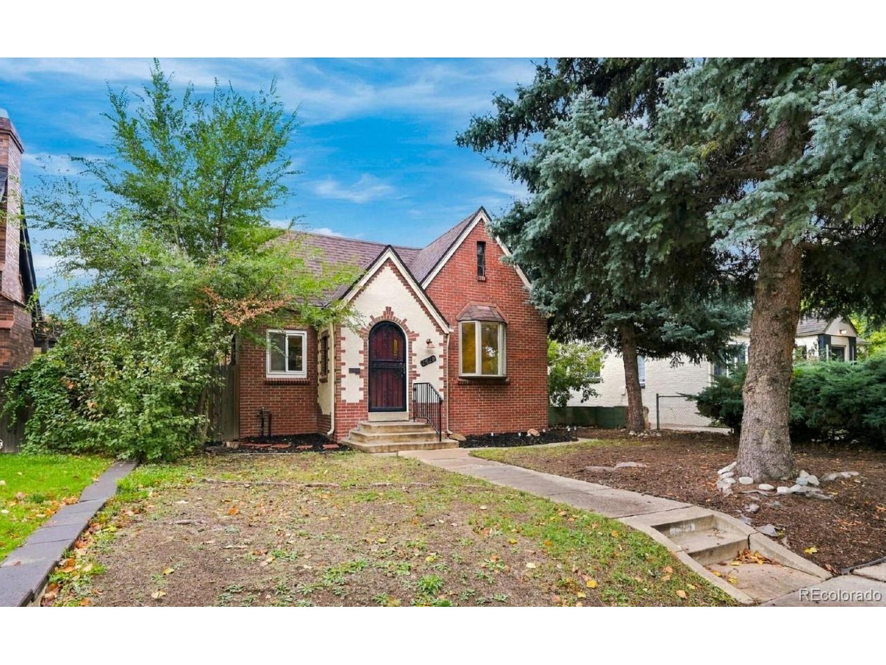 This recently updated historic home holds so much character to go along with a very spacious floor plan. This home is located in East Denver near Denver City Park. This 3-bed and 3-bath home includes a 2-car garage, two private outdoor fenced areas, and two wood-burning fireplaces. Entering the front door, you will immediately notice the refinished hardwood floors throughout the home. Through the entry, you arrive in the large living room with the first fireplace and large windows pouring in natural light. To the left is the dining area and the large kitchen. The kitchen is fully equipped with granite countertops, a pantry, and stainless steel appliances. The main floor features two of the three bedrooms, with the primary bedroom including an attached 3/4 bathroom and a full bathroom conveniently accessed from the hallway. The basement is mostly finished, allowing access to the garage and a separate living area where you have your second fireplace. In addition to the laundry hookups and extra storage, there is a third bedroom with a large egress window and a full bathroom. Located just off of Colfax Ave, Monaco Parkway, and Colorado Blvd, the home is within walking distance to shopping, groceries, entertainment, and dining. Schedule your tour today!