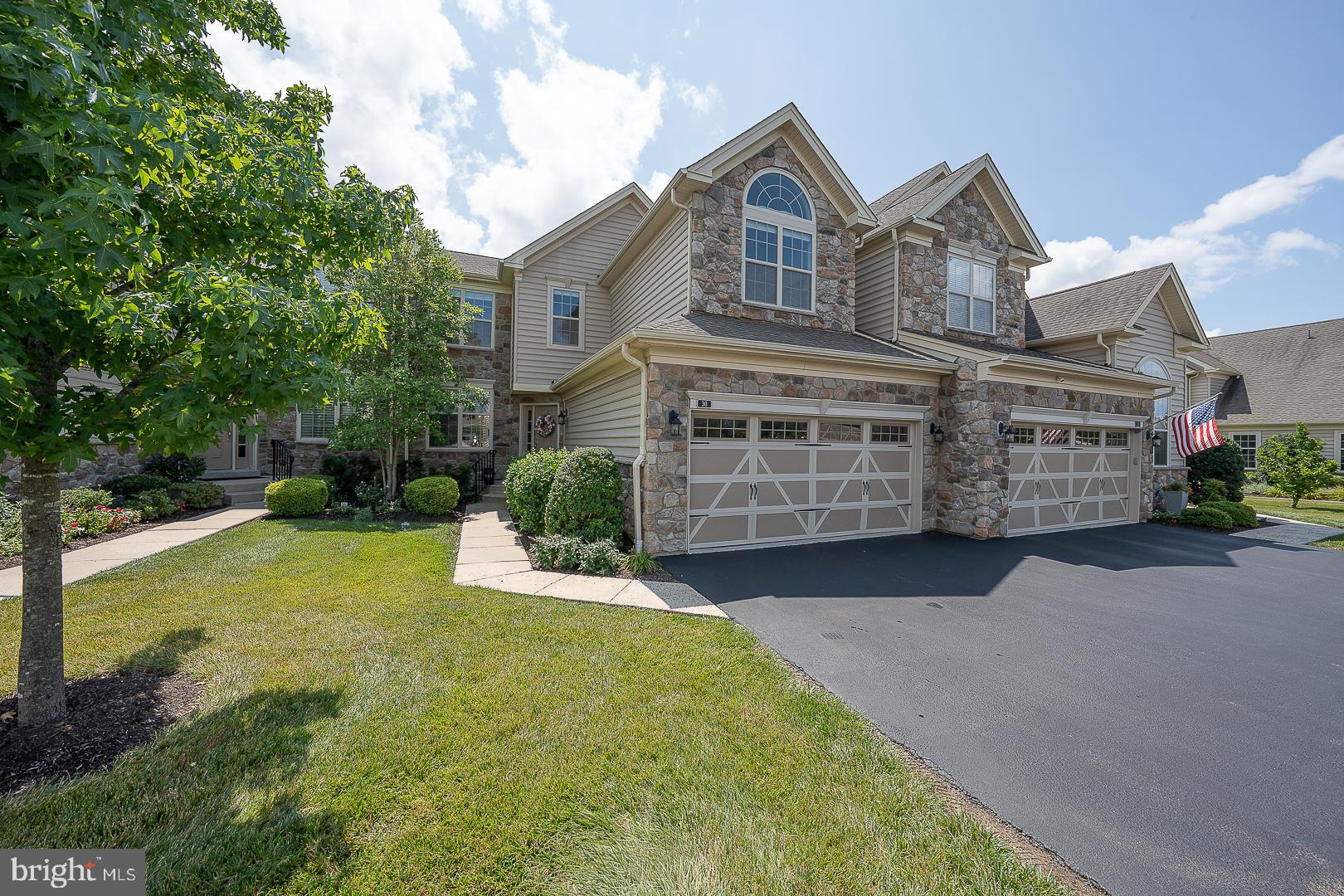 Introducing 30 Meadow View Lane, a beautiful townhome situated on one of the most sought-after lots in the popular Applebrook Meadows community in Malvern. This meticulously maintained “Vassar” model features an in-demand FIRST FLOOR PRIMARY SUITE among the 3 bedrooms, 3.5 bathrooms and boasts upgrades galore across its 3,500+ square feet. Enter to a tasteful, two-story foyer with upgraded Williamsburg oak staircase. Just off the foyer is the dining room, complete with upgraded crown molding and chair rail. Continue into the bright and airy gourmet kitchen with stainless steel appliances, including a combination wall convection oven and microwave, cream colored cabinetry, recessed lighting, a wide island with stools, a sleek tiled backsplash, and built-in desk. The spacious living room (four feet deeper than the standard Vassar model) has a cathedral ceiling with ceiling fan, recessed lighting, gas fireplace, wood floors, fabulous natural light thanks to the nearly floor-to-ceiling windows, and direct access to the upgraded larger private deck (approximately 20 ft x 20 ft) with sweeping views of picturesque community open space. Conveniently located just off the living room, the expansive primary suite (four feet deeper than the standard Vassar model) features a cathedral ceiling, lighted ceiling fan, wood floors, two walk-in closets, and an ensuite bathroom with double sinks, tons of cabinets on the vanity, oversized soaking tub, and upgraded glass-enclosed stand-up shower with seat and tile base. For ease of access, a door connects the primary bathroom to the laundry room, which includes a utility sink and storage cabinets. The laundry room may also be accessed off of the entry foyer. A half bathroom with upgraded vanity, coat closet and inside access to the oversized two-car garage complete this level. Ascend the stairs to the second level to find a loft overlooking the foyer, which can function as an additional living space, office, play area – you name it! The loft features recessed lighting and a ceiling fan. Next to the loft is a full hall bathroom with dual sinks, a tiled tub shower and linen closet. Two bedrooms with ceiling fans complete this level, one of which features a cathedral ceiling, Palladian window, a walk-in closet, and private access to the hall bathroom. The expansive finished basement with egress window, luxury vinyl plank flooring and recessed lighting provides 1,000 square feet of living space and the full bathroom adds convenience and flexibility. This stunning townhome also features a laundry list of items that you did not realize you needed until you had them, including two-zone HVAC with separate thermostats for the basement and two main levels, Level 2 CCS home EV charger, Hunter Douglas window treatments throughout, and much more. The community clubhouse (which hosts a plethora of events annually), gym and pool are a quick two-minute walk, and for a longer walk, the community’s paved walking path, as well as the adjacent 126-acre Willisbrook Preserve and neighboring 55-acre East Goshen Township Park and Applebrook Park provide multiple trails, sport courts and a playground to enjoy the great outdoors. Finally, this home is a commuter’s dream, with quick access to Routes 202, 100, 3 and the Malvern Train Station (SEPTA's Paoli-Thorndale Line). Schedule your showing today and make this exquisite townhome in the highly-rated Great Valley School District yours!
