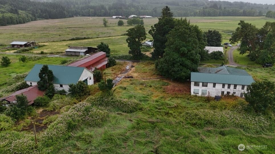 Located beside Wahkiakum’s iconic Covered Bridge, this 5-acre property features a massive 48x116 barn and a home mid-renovation. Metal roof, vinyl siding/windows already in place. Inside you’ll find a spacious great room with a second kitchen, oversized living area with fireplace and bar, and a huge primary suite with jacuzzi tub and shower. Tons of storage throughout. Packed with potential.