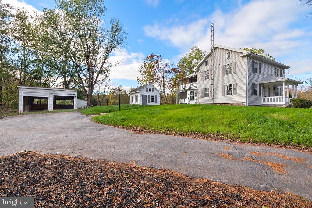 Charming Taneytown Farmette — Experience the beauty of country living on this 13+ acre property in Carroll County. This partial log home features 3 bedrooms, 2 baths, and warm wood floors throughout. A detached summer kitchen adds historic charm and flexibility, while the classic bank barn with its original stone foundation remains intact, offering endless potential for restoration or storage. Enjoy peaceful views, abundant wildlife, stream frontage and open space ideal for hobby farming or outdoor recreation. Conveniently located just 11 miles from Westminster, 30 miles to Frederick, and 16 miles to historic Gettysburg — a perfect blend of rural tranquility and easy access to nearby towns.