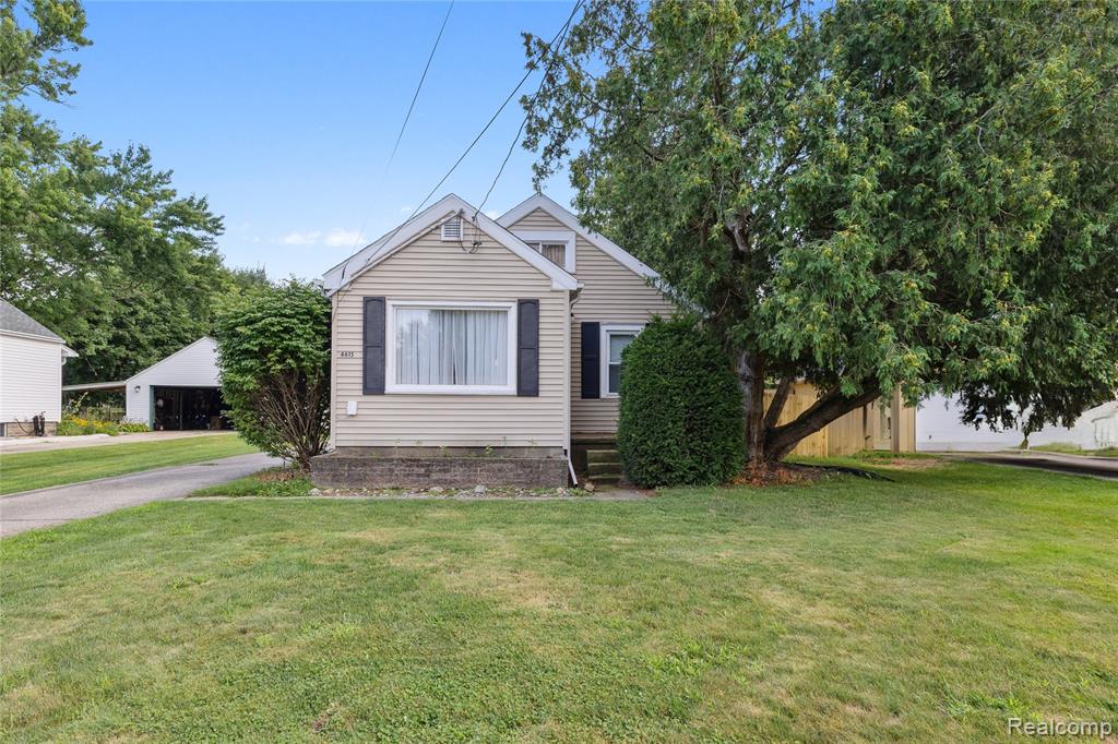 Welcome to your new home in the heart of Holt! This well-maintained house has been lovingly prepared for its next owner and boasts of many new updates including new flooring, a new AC unit, and a new privacy fence that perfectly frames your little backyard haven. The back deck and awning are great for cozy mornings or evening gatherings after spending time in town.

The heated garage with electricity is a dream for hobbyists and has been the perfect space over the years to woodworkers. There is additional space for storage in the shed in the back as well.

Step inside and you will find a large open kitchen and dining space for entertaining, a spacious living room filled with natural light, and a generous bathroom space with hookups ready for a stackable laundry unit if you would like to bring it upstairs from the basement. The upper level offers additional living space that can flex into a recreational room, home office, additional bedroom, or even more storage space.

You'll find that every detail shows the care the current owners have put into preparing this home for its next chapter. With bright, natural lighting, cozy warmth for the upcoming holidays, and room to make it your own, this is truly a treasure in the heart of Holt.

Come see for yourself why this home is the perfect blend of comfort, character, and convenience. With its careful upkeep and prime location, this home checks all the boxes and is truly one you don’t want to miss. Schedule your showing today!