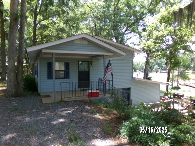Wake up every morning with a view of the lake right from your master bedroom with this waterfront home. Located on Lake Blackshear right next to one of the best spots to enjoy food and drinks on the water, Booger Bottoms! This home sits on over an acre of land and comes with its own dock. The spacious back deck provides plenty of room for entertaining while enjoying the view. This home offers 3 beds, 2 baths, and an open concept kitchen/ dining/ living area with gorgeous views of the lake. Call today for a showing!