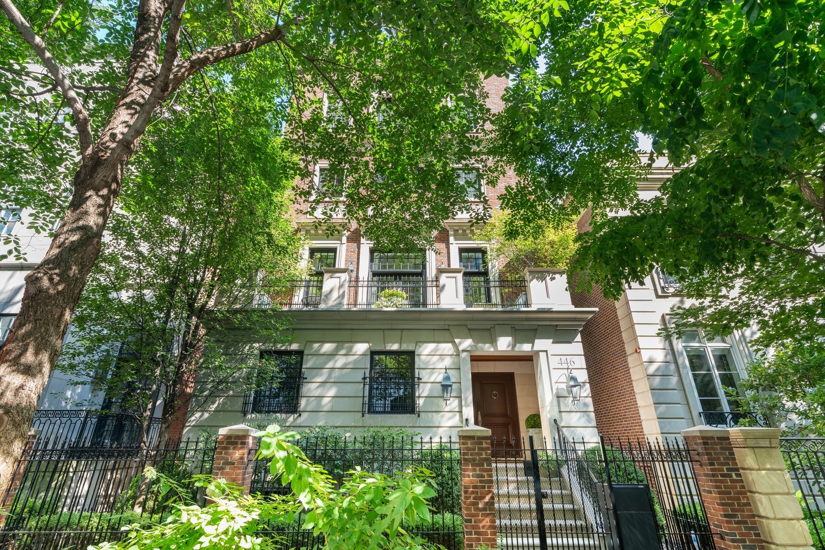 This masterfully designed 6-bedroom, 6-bathroom single-family home in Near North offers over 8,500 square feet of bespoke living space. Paired with four private outdoor areas, this is a rare opportunity to experience expansive, luxurious city living in one of Chicago's most sought-after neighborhoods. The residence is a true showcase of craftsmanship, scale, and thoughtful detail. The south-facing facade fills the home with exceptional natural light. The elegant limestone and brick exterior is enhanced by mature trees and professionally landscaped perennials, creating an impressive yet inviting street presence. Inside, a classic black-and-white marble foyer leads to interiors rich in sophistication and texture, featuring Carlisle wide-plank, hand-scraped hardwood floors, and premium fixtures and hardware by Rocky Mountain, Perrin & Rowe, Hansgrohe Axor, Devon & Devon, Rohl, and Kohler. No expense was spared in the home's high-end finishes. The first level includes a light-filled living room with a fireplace, a dedicated office, a private en-suite bedroom-ideal for guests or an au pair-and access to the attached two-car garage. On the main level, the heart of the home is the incredible chef's kitchen, where Calacatta marble countertops, custom cabinetry, and designer finishes set the tone for refined entertaining. Appliances are best-in-class, including two Sub-Zero refrigerators, a 48-inch Wolf range with 1.5 ovens, a Wolf warming drawer, and two Miele dishwashers. A walk-in pantry and charming breakfast nook complete the space. The adjacent family room is anchored by a beautifully detailed coffered ceiling, floor-to-ceiling windows, and a bold fireplace, creating an inviting gathering space. A transitional sitting room opens into the formal dining area, where soaring ceilings and grand French doors lead to a beautifully landscaped, oversized terrace-an ideal setting for outdoor living. Upstairs, three en-suite bedrooms, a secondary sitting lounge, and a third-floor laundry room provide exceptional comfort and privacy. The primary suite, occupying its own entire level, is a private haven featuring a Juliet balcony, fireplace, custom-designed closets, and an oversized dressing room with dual accessory islands. The spa-quality bath includes premium fixtures by Perrin & Rowe, Hansgrohe, and Kallista, a soaking tub, dual vanities, and a walk-in shower-delivering a full retreat experience. This level also includes a secluded primary den and a second full laundry area for added convenience. The top level is designed for elevated entertaining, featuring a sophisticated lounge with a full wet bar, dual beverage refrigerators, and two expansive rooftop terraces-one with an outdoor fireplace, perfect for enjoying city-lit evenings. A half bath completes this floor. The fully finished lower level expands the home's functionality with a spacious media/recreation room, a climate-controlled wine cellar, and a dedicated home gym. Throughout the home, additional high-end touches include designer window treatments, custom millwork, and four total fireplaces. A Control4 smart home automation and security system provides seamless control of lighting, temperature, and security, while built-in outdoor speakers enhance the ambiance on both the second-floor terrace and the rooftop deck. Perfectly located just steps from Ward Park, the Chicago Riverwalk, and the River North Design District-and within walking distance of East Bank Club with easy access to the Loop-446 W. Huron is a rare blend of design, comfort, and urban convenience. An extraordinary opportunity to live beautifully in the heart of Chicago. Ogden School District, too!