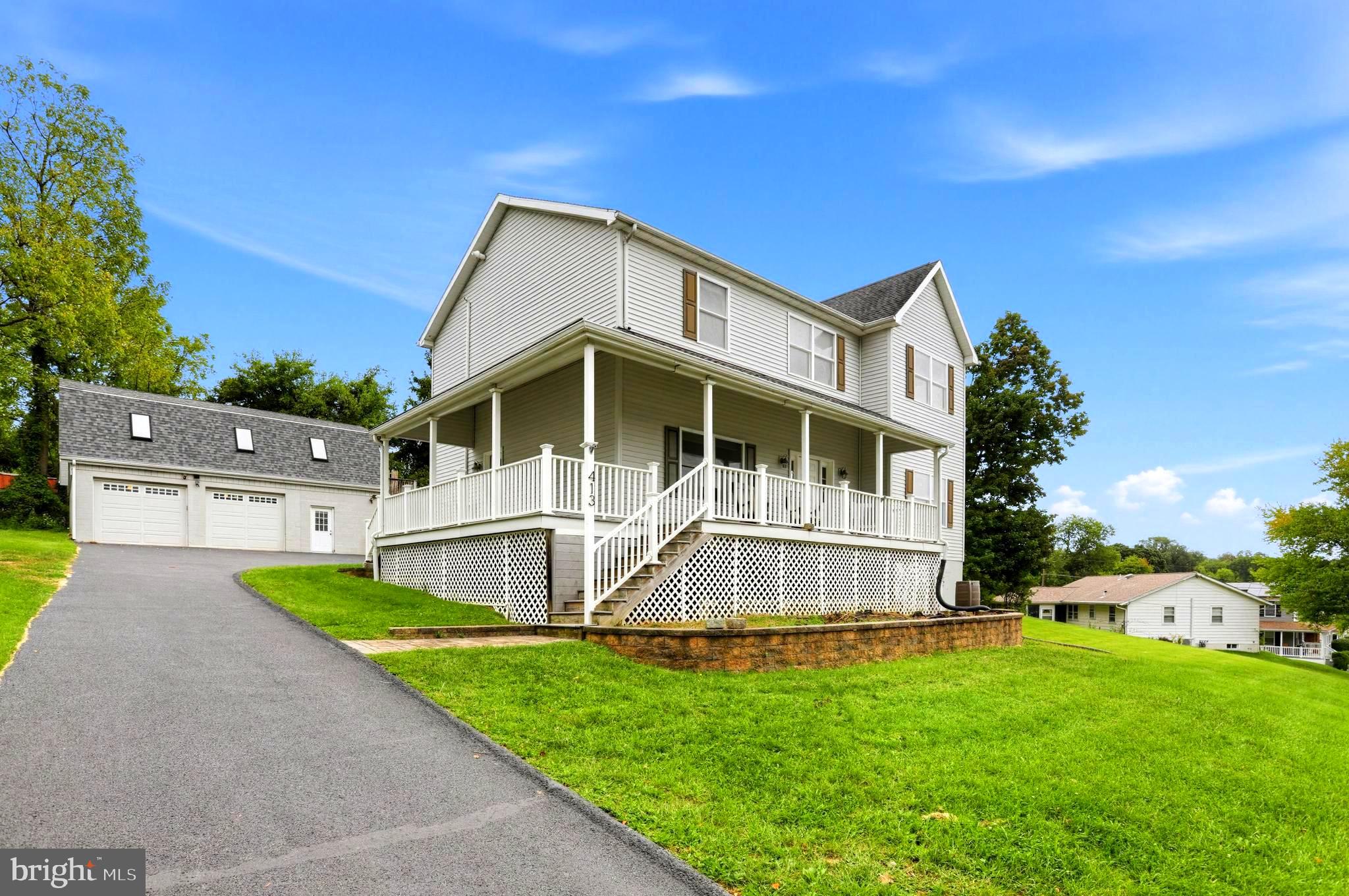 Set atop a hill on a peaceful street in Hulmeville Borough, this spacious custom Colonial offers an impressive amount of space, a versatile floor plan, and a unique detached garage with room for so much more. A large covered wraparound front porch with low-maintenance composite decking welcomes you into the home, where gleaming hardwood floors, 9-foot ceilings, a warm color scheme, and generous room sizes create a bright and comfortable feel. The main level offers separate living and dining rooms, a spacious family room, and a well-appointed kitchen featuring granite countertops, an undermount sink, stainless steel appliances, travertine tile flooring, and a large center island. A convenient main-level laundry room with built-in shelving and a powder room complete the first floor. Upstairs, the primary suite includes a private bath with a soaking tub and separate shower. Three additional generously sized bedrooms share a hall bath. The full walkout basement features high ceilings, abundant storage, and future finishing possibilities, already plumbed for an additional bathroom. Outside, the nearly half-acre property offers a wonderful backyard setting along with one of the home’s standout features: an oversized, two-story detached two-car garage with three mini-split systems providing heating and cooling throughout its distinct spaces. On the first floor, a finished office with tile flooring, its own temperature control, and convenient access to a half bath creates a comfortable year-round workspace. The separate two-bay garage area is also heated and cooled. Upstairs, a wide-open flex space features skylights, is fully wired with installed lighting, and has a third zone for temperature control. Ready for your finishing touches, this expansive second level offers exciting possibilities for a studio, creative workspace, recreation area, or additional storage. Situated in the Neshaminy School District with easy access to I-295, Route 1, and local regional rail, this home perfectly balances small-town charm with suburban convenience. Enjoy quiet mornings on the wraparound porch, sunsets from the hilltop setting, and the exceptional versatility that makes this property truly distinctive.
