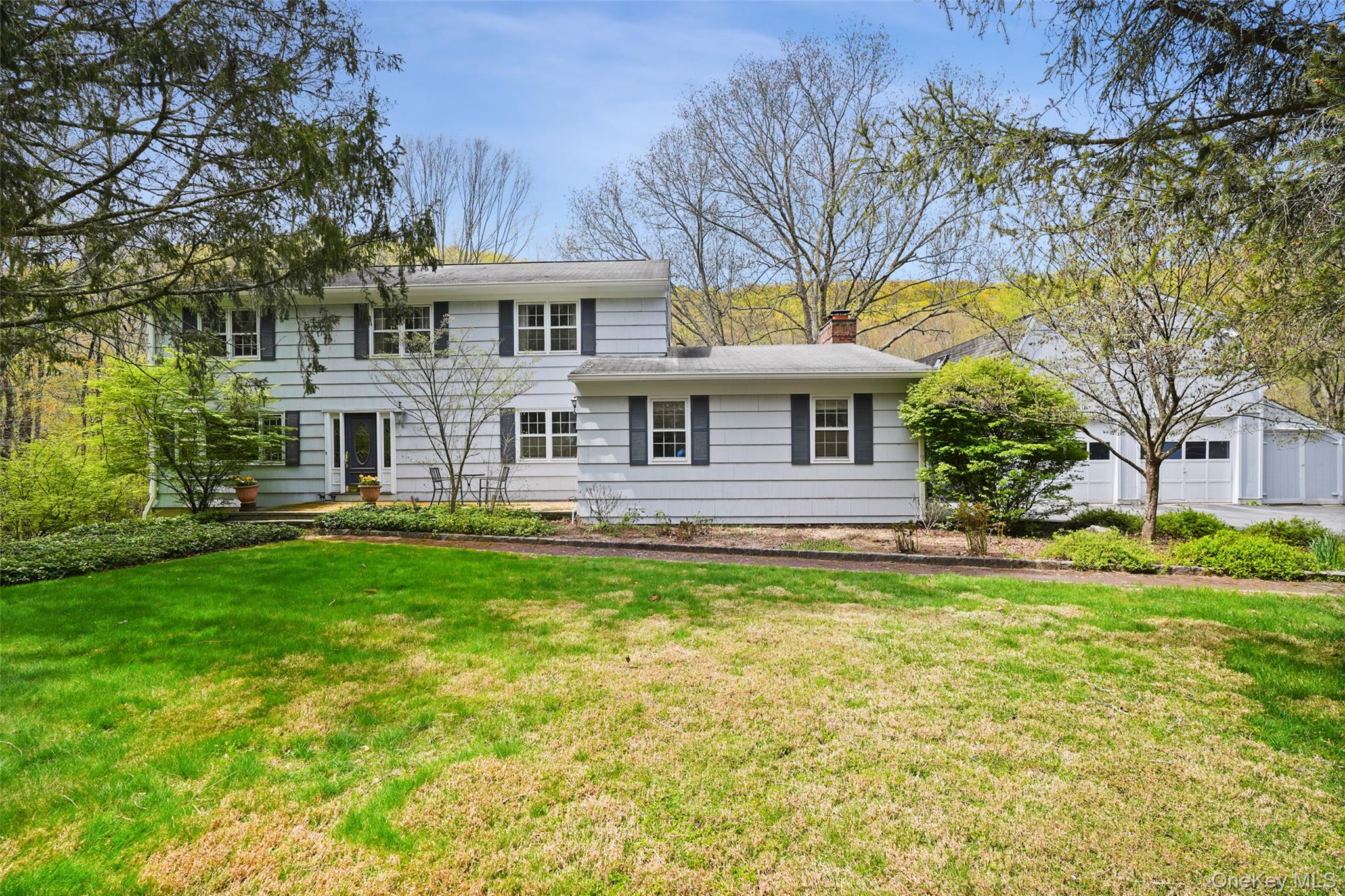 Lovely and inviting 4 bedroom house, set on a remarkable property adjoining Ward Pound Ridge Reservation. This property offers quiet privacy, scenic views, and direct access to thousands of acres of protected parkland. The property features a large spring-fed pond, two streams, and immediate access to miles of multi-use trails for year-round recreation. Generous living spaces provide a comfortable layout for everyday living and entertaining, while the attractive and spacious rear deck and three-season sun porch overlook the natural surroundings and a charming barn. A detached garage includes approximately 750 square feet of finished space above, offering flexible use options. Conveniently located near main roads, Metro-North, shopping, dining, and parks, the property combines a peaceful setting with access to everyday amenities. The house is serviced by a full house generator, creating peace of mind and convenience.
