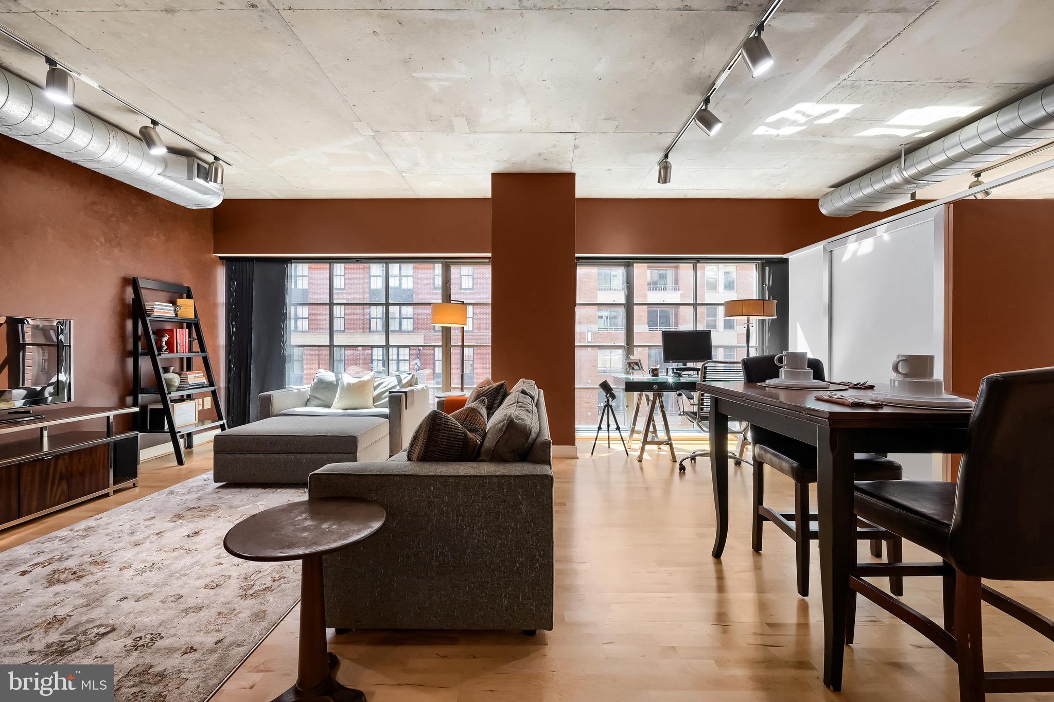 Welcome to Eight50 Aliceanna, a sophisticated one bedroom, one bath condominium in the heart of Harbor East offering over 1,000 square feet of well designed living space. This NY-style loft features high ceilings, hardwood floors throughout, and expansive walls of windows that bring in abundant natural light and showcase attractive city views. The open concept living and dining area connects seamlessly to the kitchen, which is equipped with stainless steel appliances, granite countertops, and a breakfast bar, making it ideal for both everyday living and entertaining. The spacious primary bedroom includes two closets, while the well appointed bathroom features a walk in shower with clean, contemporary finishes. A highly desirable parking space located on the same floor as the residence adds exceptional convenience. This boutique condominium is ideally situated just steps from Harbor East’s restaurants, boutique shopping, Whole Foods, Starbucks, the waterfront, the Inner Harbor, and vibrant city amenities. The condo fee includes air conditioning, heat, water, and trash offering a low maintenance lifestyle in one of Baltimore’s most sought after neighborhoods.