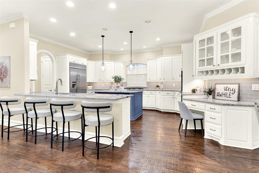 **OPEN HOUSE SATURDAY NOV. 15TH, FROM 1-4PM** Wonderful home in the desirable Lakeside on Preston neighborhood, close to the community pool and tennis courts! Luxury touches in every room include plantation shutters, handscraped hardwood floors, abundant built-ins and more. The recently renovated utility room is remarkable with built-in cabinets and cubbies, updated sink and fresh paint! What you'll really love is the huge gourmet kitchen with granite counters, sleek white cabinets, built-in KitchenAid refrigerator, KitchenAid 6 burner gas cooktop and double gas convection ovens! Combine that with a handy butler's pantry, walk-in pantry, planning desk with storage and wine storage, you'll be preparing meals in your dream kitchen! The sunny breakfast nook and grand family room flow from the kitchen. The family room offers a gas log fireplace flanked by built-in cabinets and entertainment center. A luxurious primary suite offers backyard views and a spa-like bath with dual vanities, soaking tub, oversized shower and impressive walk-in closet with built-ins. A family friendly backyard is just beyond the covered patio - time to start planning your dream outdoor kitchen and living space! An executive home office and sublime formal living and dining rooms complete the first floor. The second level offers a large game room and three bedrooms, one with a private bath. Great location close to Preston Road, DNT, 190, Legacy West, Stonebriar Mall and more.