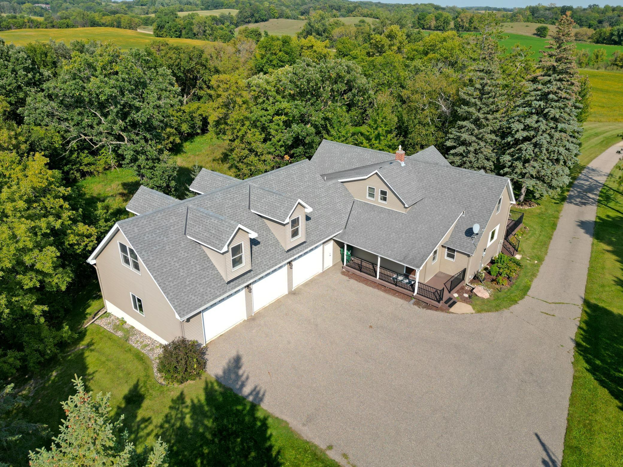 Own your own piece of paradise among the rolling hills and forests spanning 52 acres of land surrounded by Stanley Eddie Park. The home has been remodeled offering an over sized 3-car garage with unfinished living space above, addition including a great room, primary suite and lower-level family room with a bedroom. The great room boasts soaring tongue & groove vaulted ceilings, gas fireplace with stone surround and floor to ceiling windows. The remodeled kitchen features custom rustic hickory cabinetry, farm sink, granite counter tops with an island and a barn door leading to a 10x5 pantry. Relax in the infra-red sauna in the lower level and the hot tub outside on the expansive, pressed concrete patio. Maintenance free decking adorns the east side of the home and porch on the west side. A barn and pole shed make this a perfect place for a hobby farm. Countless deer, turkeys, and lots of wildlife visits.