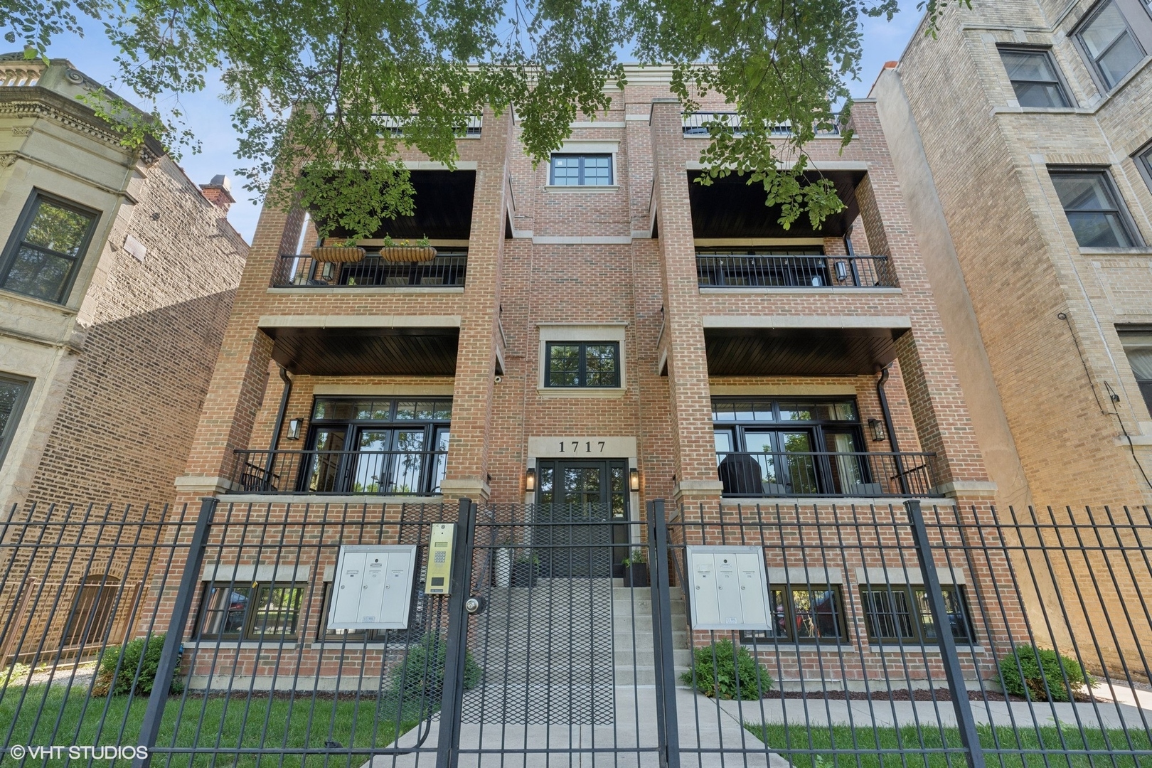 Stunning newer all-brick 3-bedroom, 2-bathroom condo located on historic Humboldt Boulevard, just steps from the 606. This home offers two private outdoor spaces, including half of the garage roof deck with a pergola that is perfect for entertaining. Thoughtfully designed, it features 10-foot ceilings, wide-plank soundproof hardwood floors, premium soundproofing between walls, Andersen specialty insulated windows, and Ipe wood finishes. High-end kitchen showcases Bosch stainless steel appliances, quartz countertops with undermount sink, contrasting white and dark greige cabinetry, herringbone tile backsplash, and an island with additional storage + overhang for seating. Open living and dining area flows seamlessly off the kitchen and opens to a private west-facing balcony overlooking the tree-lined street. Private primary suite is a true retreat with a spacious walk-in closet and spa-like ensuite bathroom with double-sink vanity and step-in shower with body sprayer. Two additional bedrooms are bright and well-proportioned, with convenient access to the second full bathroom with a shower/tub combo. Additional highlights include full-size in-unit laundry, Nest Thermostat, recessed lighting, ample storage, and unbeatable access to the 606 Trail, Blue Line, Palmer Park, Humboldt Park, and the vibrant Logan Square dining and brewery scene. Garage parking space is included in the price.