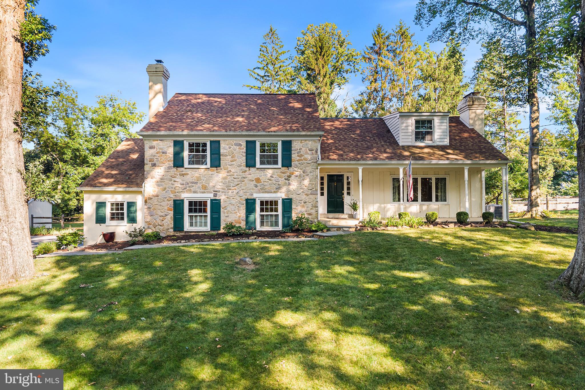 Move in and get settled before the school year begins! Brimming with charm and character and located on a quiet cul-de-sac in Tredyffrin-Easttown School District, this beautifully maintained stone-and-stucco Colonial split offers generous living space, thoughtful updates, and a friendly neighborhood known for its community gatherings.A flagstone walkway leads to the covered front porch and welcomes you inside, where abundant natural light creates a warm and inviting atmosphere. The first floor offers an easy flow for both everyday living and entertaining. The tastefully appointed kitchen, featuring newer appliances and hardwood floors, opens to the dining area and spacious living room with a wood-burning fireplace. Direct access to the screened porch and flagstone patio creates a seamless connection between the indoor and outdoor spaces, making this level especially well suited for gatherings.One level down, the family room, rich with architectural detail, showcases exposed wood beams, beautiful hardwood floors, a second wood-burning fireplace, and a wet bar. This level provides access to the driveway through a convenient mudroom, while a recently renovated  laundry space and powder room and garage access round out the floor. The third floor includes two bedrooms that share a beautifully renovated hall bath, along with the primary suite, which features a walk-in shower and a separate sitting room with a walk-in closet. An additional spacious upper-level suite with its own tub and shower offers great flexibility for guests, an in-law suite, or a home office. A floored walk-up attic provides plenty of additional storage, while the finished lower level offers even more space for a recreation room, gym, office, or playroom.Enjoy easy outdoor living with a screened rear porch, expansive flagstone patio, and fully fenced, level backyard—not easy to find in this area. Beautifully landscaped grounds feature rose and perennial gardens and a three-tiered terraced garden in the front yard. A newer storage shed with both front and rear mower-entry doors adds convenience.Additional highlights include an attached two-car garage with  a convenient 220-volt EV charging connection. Major improvements include a full shingle roof replacement in 2020, new vinyl siding and shutters installed in 2025, and new double-pane windows and doors in the entry level. Ideally located near Newtown Square and Paoli shopping, Route 202, and the Episcopal Academy campus, this charming and versatile home offers space, character, valuable improvements, and a true sense of community in one of Easttown Township’s most desirable settings.