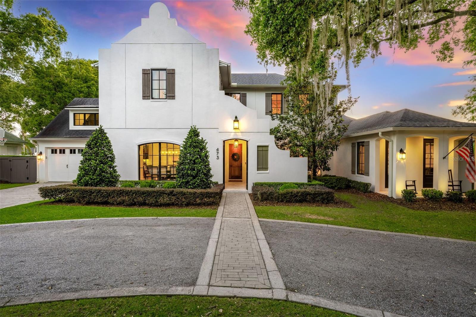 Welcome to the best of Winter Park living, where luxury meets lifestyle and every day feels like a getaway. This stunning custom home, built by Lundev, sits on a quiet, tree-lined street just a mile from Park Avenue and only steps from beautiful Lake Osceola. Imagine walking to brunch on Park Ave, then coming home to launch your paddleboard from the end of your street.From the moment you pull up, the home makes an impression from its striking architecture to the curved driveway that feels both elegant and inviting. Inside, it’s designed for the way people actually live and entertain today. The chef’s kitchen is the heart of the home, featuring a massive marble island, sleek custom cabinetry, and high-end appliances, all opening up to light-filled living spaces and three sets of French doors that flow seamlessly to the outdoors.Step outside and you’ll find your own private resort: a heated pool and spa, full summer kitchen, and a cozy cabana with a gas fireplace, all enclosed by automatic screens so you can enjoy the space year-round. Whether it’s a casual family dinner or a lively evening with friends, this backyard is one of the best in Winter Park.The first-floor primary suite feels like a spa retreat, with a soaking tub and peaceful views of the pool. Upstairs, each bedroom has its own en-suite bath, plus there’s a versatile bonus room and a large home gym that could easily flex into whatever you need, playroom, office, media space, or studio.Every detail was thoughtfully designed and beautifully executed, but what makes this home truly special is how it feels. Sophisticated yet comfortable. Private yet connected to everything that makes Winter Park so desirable. Just steps from Lake Osceola and moments from the charm of Park Avenue, this home offers a lifestyle that’s as effortless as it is exceptional.