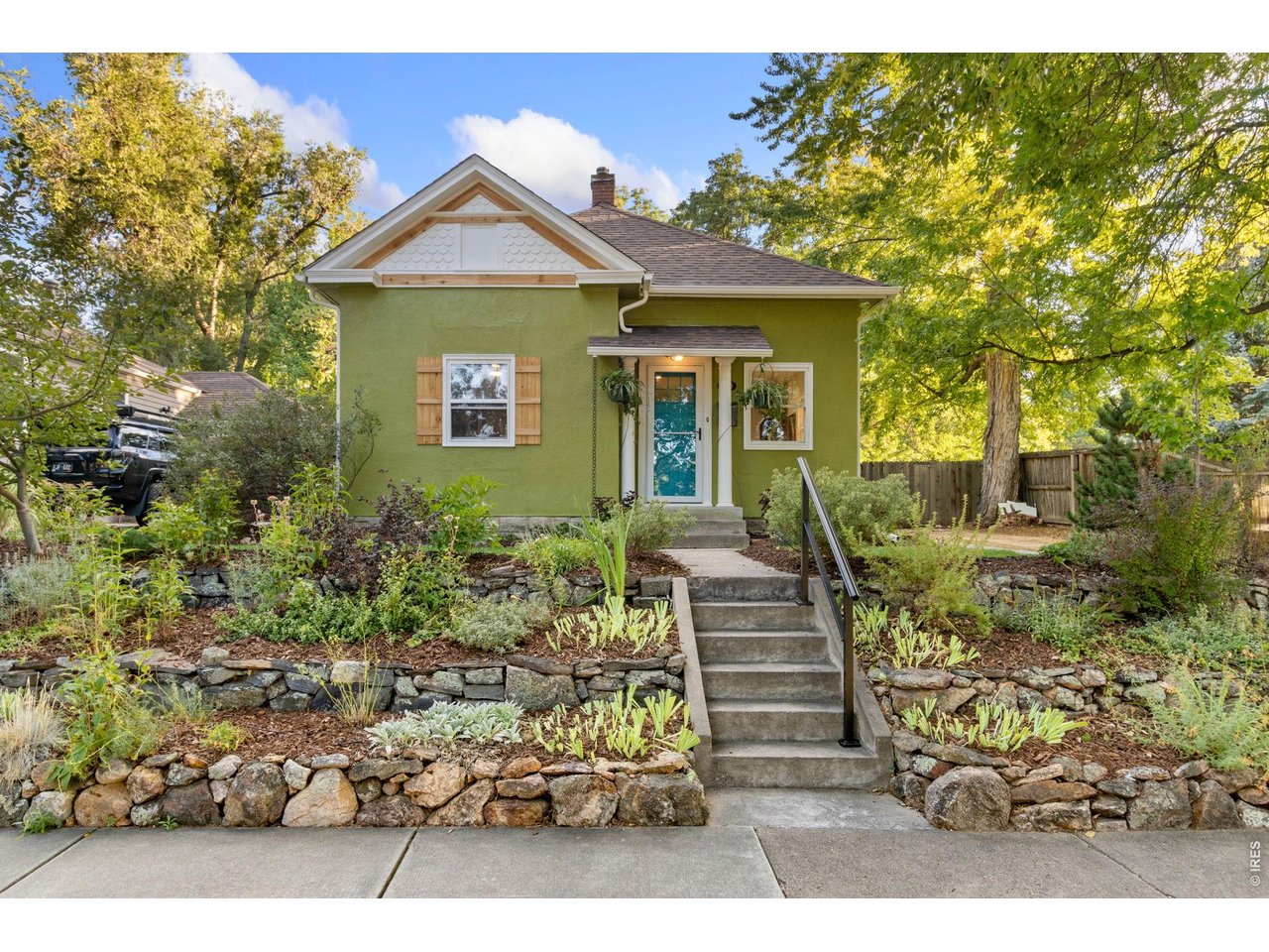 Charming Old Town Fort Collins bungalow filled with character, thoughtful updates, and wonderfully flexible spaces! This three-bedroom ranch showcases beautifully refinished original hardwood floors, fresh interior and exterior paint, and a bright, updated kitchen with new butcher-block countertops. New recessed lighting and trim add a clean, polished finish throughout. Outside, cedar accents and professional landscaping create exceptional curb appeal, while established garden beds offer peppers, tomatoes and more ready to enjoy. The private backyard features a tucked-away hot tub, a chicken-coop-ready area, and convenient alley access. The former oversized two-car garage was transformed into an impressive year-round art studio complete with heating, cooling, and a bathroom-perfect for creative pursuits, hobbies, a workshop, or a private home office. Prefer to have the garage space? - No problem! We'll turn it back into a garage for you! Located just minutes from Old Town's shops, restaurants, and local attractions, this inviting neighborhood is known for its mature tree-lined streets and one-of-a-kind homes. A special property offering vintage charm, modern updates, and the quintessential Old Town lifestyle!