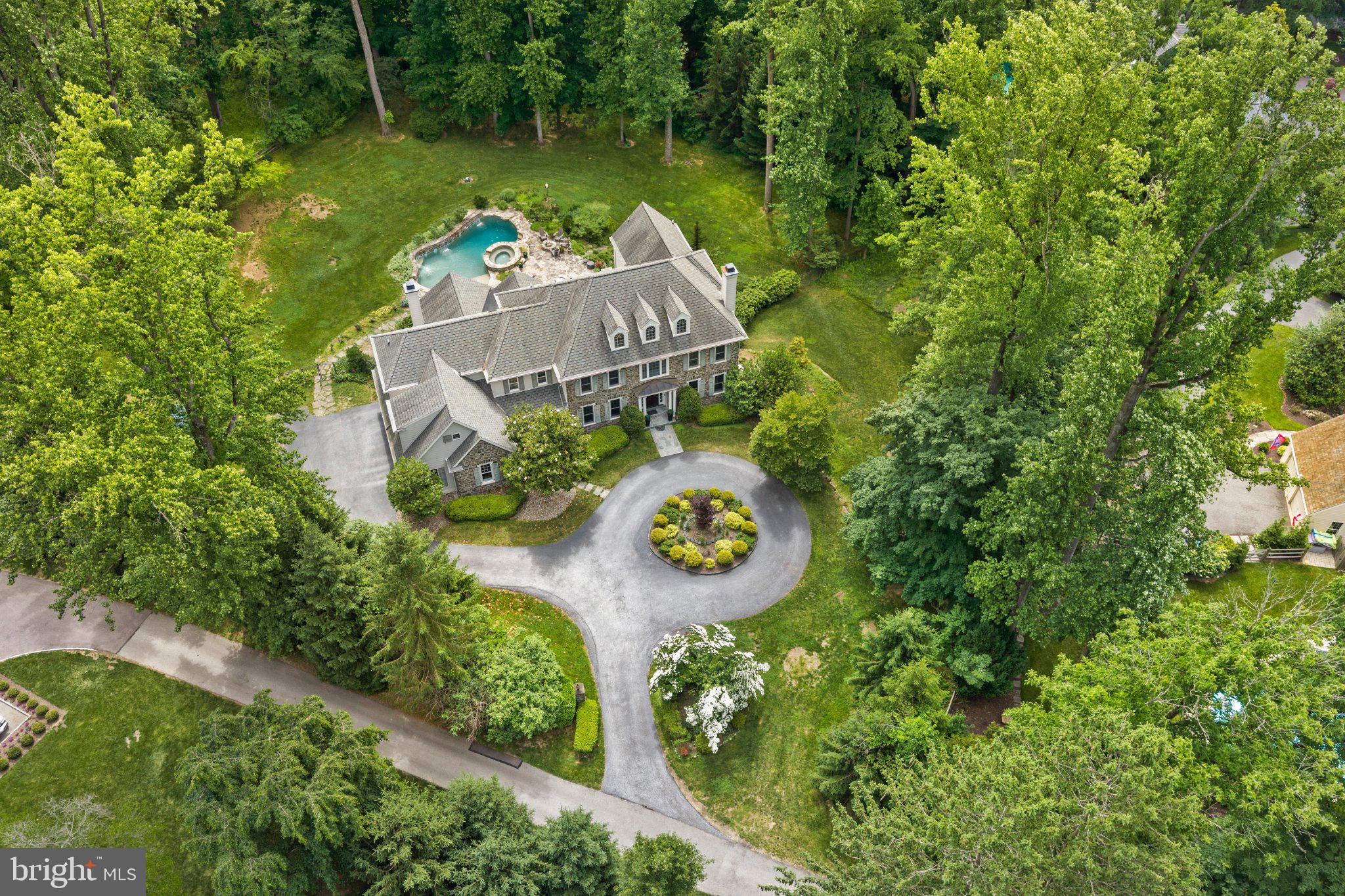 Set along a private drive in the heart of the Main Line, this exceptional Halesworth model by Lee Haller offers a rare blend of timeless craftsmanship, modern upgrades, and resort style living. With 6 bedrooms and 5 full and 2 half baths, this home is designed to feel both expansive and intimate, delivering a true sense of retreat just moments from everything the Main Line has to offer.From the moment you arrive, the setting feels like a hidden oasis. Surrounded by mature landscaping and thoughtfully cleared grounds, the property offers unmatched privacy and serenity. The backyard is a destination in itself, featuring a sparkling pool and hot tub, perfect for quiet mornings, summer entertaining, or unwinding at the end of the day.Inside, the home has been extensively refreshed with a refined, neutral palette and elevated finishes throughout. Sunlight fills each space, highlighting detailed millwork, updated trim, and beautifully reimagined interiors. The second level has been enhanced with rich hardwood flooring, while both the main and secondary staircases have been upgraded with elegant oak risers, adding continuity and sophistication across levels.The home’s infrastructure has been equally elevated, offering peace of mind and modern convenience. A comprehensive whole-home water treatment system with carbon filtration, softening, and UV purification ensures exceptional water quality, complemented by a new well pressure tank and sump pump system.Every detail has been considered to enhance both form and function, from newly installed appliances including a Maytag front load washer and dryer to extensive exterior improvements that open up the landscape and maximize usable space.Beyond the home, the location is equally compelling. Situated within the award-winning Tredyffrin-Easttown School District, this property offers convenient access to some of the Main Line’s most sought-after destinations. Enjoy nearby dining at White Dog Cafe, Terrain Cafe, and Autograph Brasserie, or explore upscale shopping at King of Prussia Mall and Suburban Square. Everyday essentials are just minutes away with Whole Foods, Trader Joe’s, and Wegmans all within easy reach.For commuters and those on the move, the home provides seamless access to Routes 476, 76, and the Pennsylvania Turnpike, along with nearby SEPTA regional rail stations offering direct service to Center City Philadelphia. Outdoor enthusiasts will appreciate proximity to the Radnor Trail, Jenkins Arboretum, and Valley Forge National Historical Park, offering miles of scenic walking trails and green space.This is more than a home, it is a private retreat designed for elevated everyday living, where luxury, comfort, and convenience come together in one of the Main Line’s most desirable settings. Full stucco remediation completed June 2026. New Hot Water Heater. New HVAC unit.