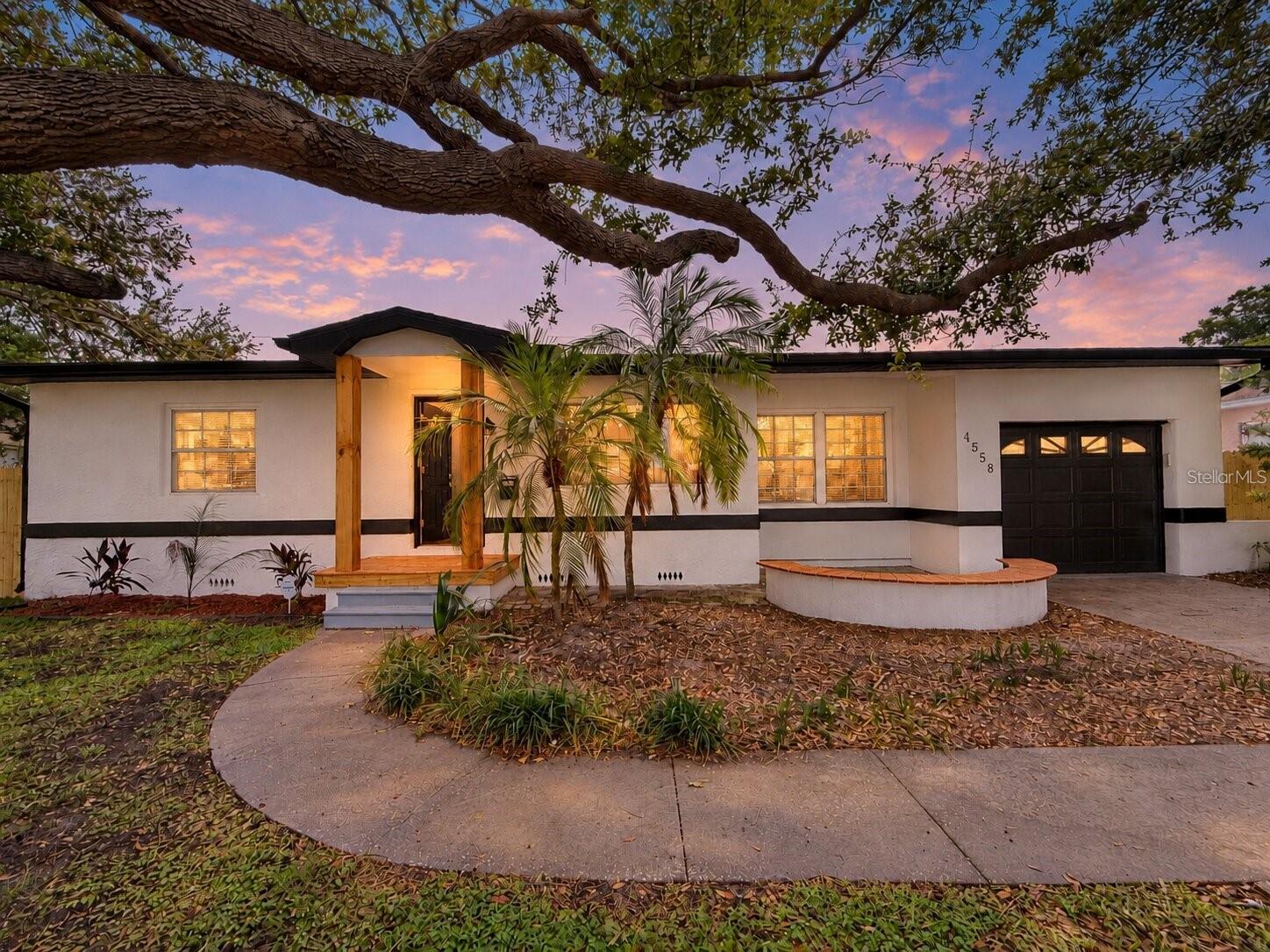 Virtually Staged. One or more photo(s) was virtually staged. A NEW ROOF, NEW A/C, and thoughtfully redesigned living spaces bring fresh appeal to this 3-bedroom, 2-bath BLOCK home in Leslee Heights. A mature shade tree, curved walkway, and refreshed landscaping welcome you to 1,466 square feet of inviting interiors.The opened-up living and dining areas connect to a NEW KITCHEN featuring white shaker cabinetry, quartz countertops, a center island, and new stainless steel appliances. Luxury vinyl plank flooring, updated lighting, new interior doors, and fresh paint create a consistent finish throughout. Both bathrooms have been remodeled with updated vanities, fixtures, and decorative tilework.A covered, screened rear porch overlooks the spacious fenced backyard, offering a comfortable spot for morning coffee or outdoor dining. Improvements include replacement sections of wood fencing and irrigation extended into the backyard. An attached ONE-CAR GARAGE and indoor laundry with an included washer and dryer add everyday convenience. Located in FLOOD ZONE X.*** NEW IN 2026 *** SHINGLE ROOF | 3-TON A/C & THERMOSTAT | KITCHEN & QUARTZ COUNTERTOPS | KITCHEN APPLIANCES | REMODELED BATHROOMS | LUXURY VINYL PLANK FLOORING | DOORS & TRIM | LIGHTING, OUTLETS & SWITCHES | GARAGE DOOR | INTERIOR & EXTERIOR PAINTUPDATED IRRIGATION & LANDSCAPING. Schedule your private showing today!
