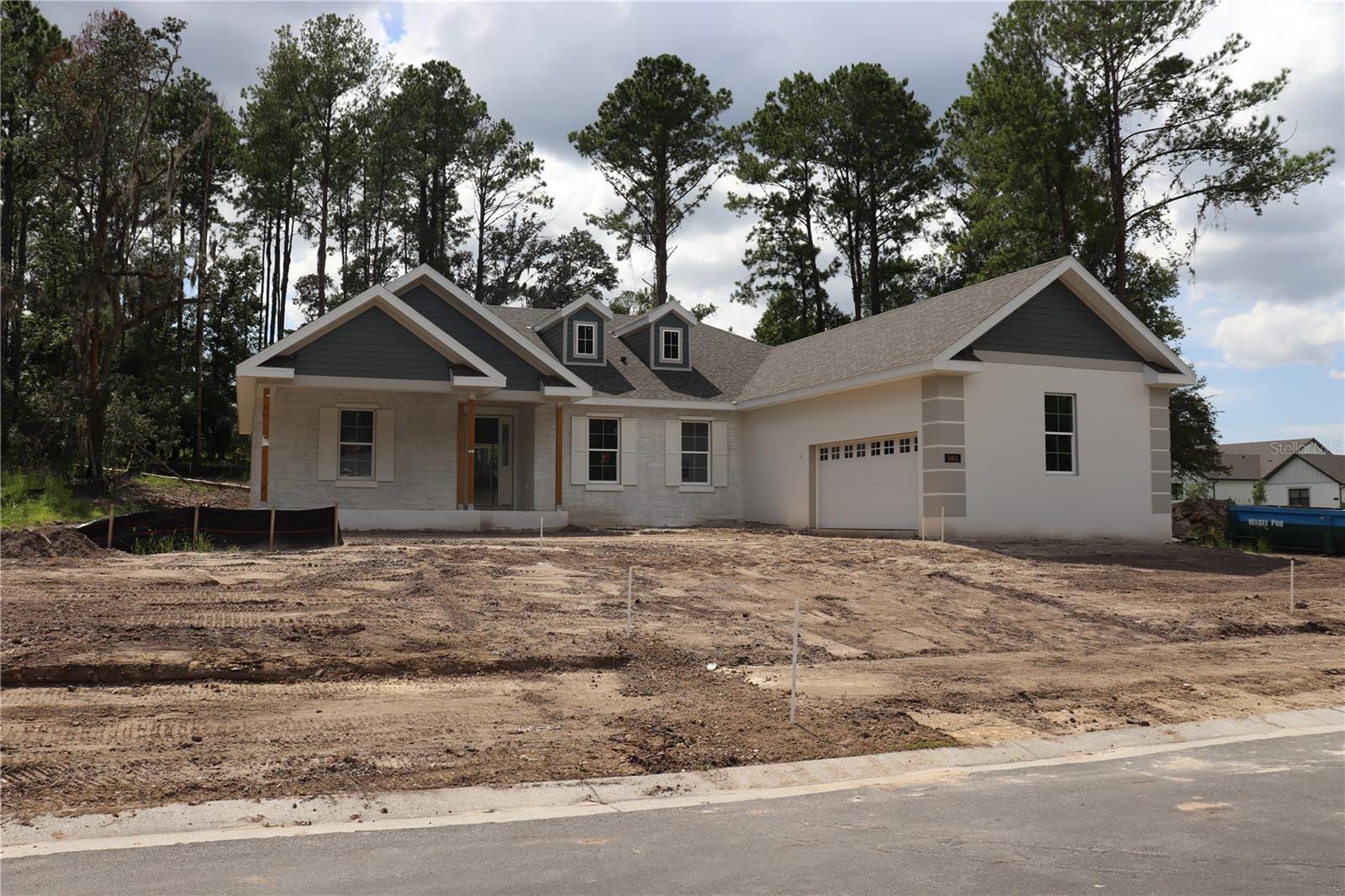 Under Construction. This stunning home, under construction by semi-custom builder Spire Homes, abounds with beautiful interior appointments and is located on one of the largest homesites in the community! This amazing home is beautifully positioned within the premier golf course and lifestyle community of Southern Hills Plantation. The lovely front exterior entry creates a warm and welcoming ambiance. Starting at the entry foyer, you will walk into a fabulous open, airy, and spacious floor plan. This home features a gourmet, chef's delight kitchen with a massive island opening to the great room, allowing for easy conversation and entertaining. The soft-close wood cabinetry throughout this beautiful home features high-end quartz countertops, a subway-tile backsplash, and under-mount lighting with dimmers. You'll also love the 5-burner gas cooktop, gas tankless water heater, and pre-plumbing, giving you the choice of a gas or electric dryer. A 13-foot-long walk-through pantry and an en-suite guest bed/bath offer fabulous uniqueness to this home. You will love the 8-foot doors and 5 1/4" baseboards throughout. The owner's suite and bath are awe-inspiring. LVP flooring in all main living areas comes with a lifetime residential warranty for further peace of mind. The expansive 35' extended lanai offers Florida outdoor living at its best. The lanai also offers a pre-plumbed gas drop for further enjoyment of outdoor living and entertainment. The oversized side-entry garage allows for significant extra storage and sets the tone for the home's exterior ambiance. Southern Hills Plantation offers a premier, manned and gated entrance and showcases a Pete Dye 18-hole Signature Golf Course. The elegant Southern Hills Clubhouse overlooks stunning rolling topography and the golf course. You'll love the Har-Tru clay surface tennis courts, pickleball courts, a full-service fitness center, swimming pool and spa, formal and informal restaurants, a putting green and driving range! If you are looking for a fabulous new home in a premier community, this home is for you! All information in this listing is intended to be accurate and is not warranted. The buyer or buyer's agent should verify all information.