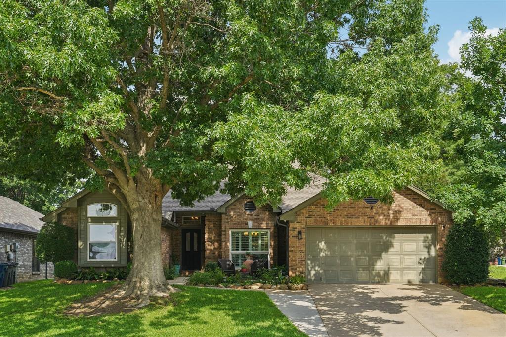 Welcome to this beautiful home nestled in the highly sought-after Glade Landing neighborhood in Grapevine. When you drive up to this large corner lot, and see the plush, green lawn and mature trees, you will see immediately how loved this home has been! Step inside the open foyer that leads to a formal dining area. Step down into an expansive living room that is flooded with abundant natural light coming through the shutters. Walk through to the second living area and cozy up to the double-sided fireplace. The updated kitchen features stainless steel appliances, and a breakfast nook overlooking the backyard. The backyard is the ultimate tropical entertainment space for summer nights by the pool. Walk through the spacious primary bedroom to the large bathroom with a garden tub. The neighborhood is teaming with life, and the home is just a short walk to a park and green space. This home is ideally located just minutes from DFW Airport, Grapevine’s Historic Main Street, Southlake Town Square, and is zoned for the highly rated Grapevine-Colleyville Independent School District.