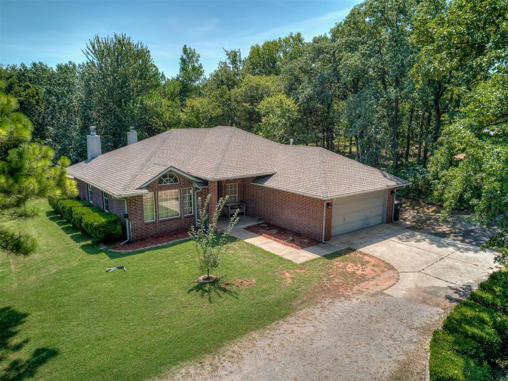 Nestled on 2 acres in the quiet community of Cinnamon Run, sits a charming 3-bedroom home with a study and open living/dining space warmed by a cozy corner fireplace and lots of windows for natural light! The study has two entries for more convenient access from different parts of the home. The kitchen comes with beautiful countertops & painted cabinetry, a breakfast bar for casual dining, and stainless-steel appliances with gas range and refrigerator included! Retreat to the primary suite which also has its own fireplace and separate access to the back patio. There you'll find a private bathroom with a whirlpool tub, walk-in shower and 2 closets! Outside, you are surrounded by a ton of trees and greenspace, allowing you privacy and serenity as you enjoy the outdoors. The open concrete patio and large wooden deck present an opportunity to create your own oasis for relaxing and entertaining with direct access into the dining area for quick transition from grill to table. Don't miss out on this opportunity to experience country living with quick access to HWY 9 and Lake Thunderbird.  Updated with fresh paint and newer heat/air system. Norman Schools.