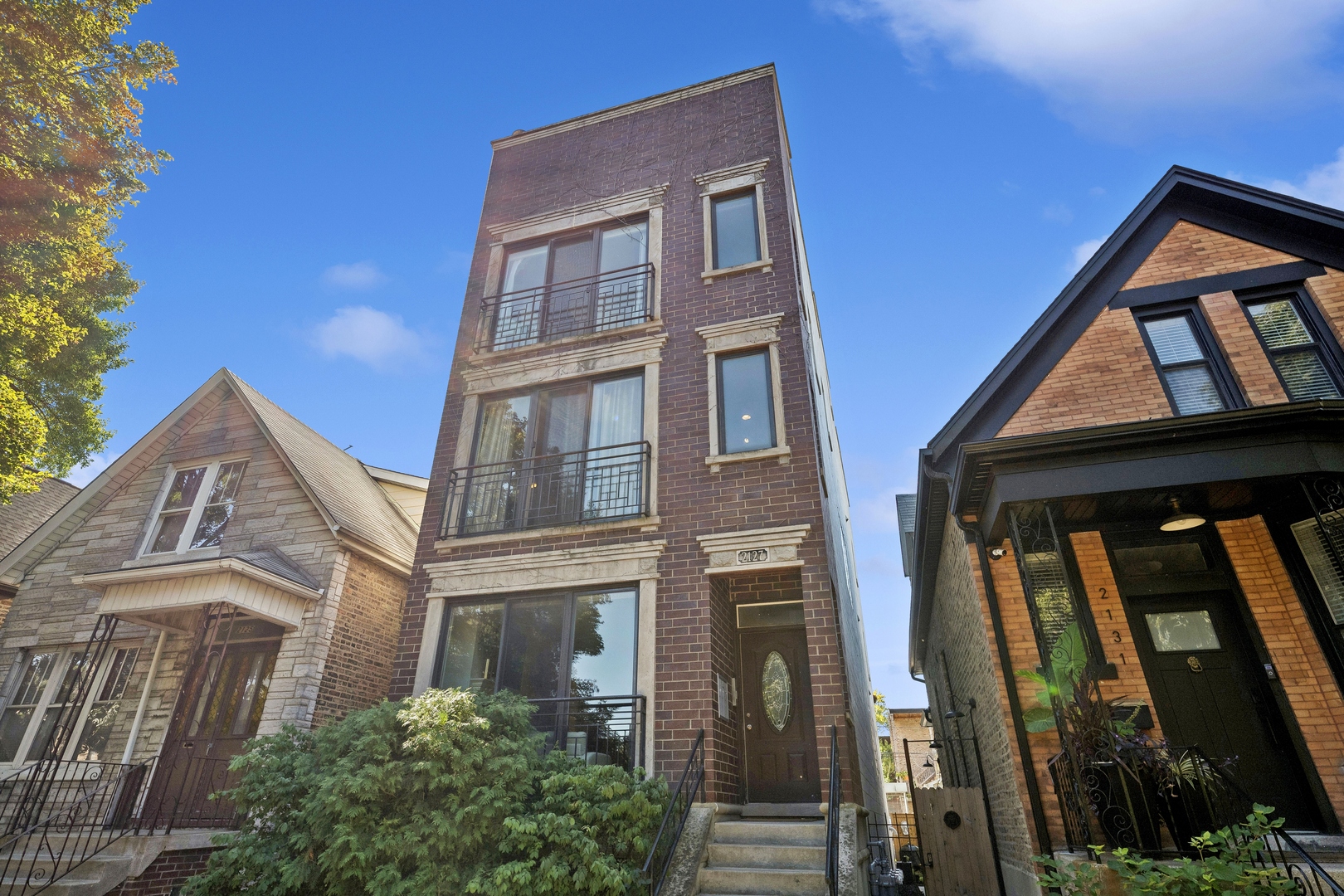 Located on a quiet, tree-lined street in the heart of Ukrainian Village, 2127 W Walton offers the perfect blend of charm, space, and functionality. This thoughtfully designed home features an open-concept main floor flooded with natural light from floor-to-ceiling front windows, complemented by crown molding, recessed lighting, and a cozy gas fireplace. The kitchen is equipped with stainless steel appliances, quartz countertops, a breakfast bar, and a dedicated dining space-ideal for entertaining or everyday living. Freshly painted throughout, the home boasts hardwood floors on both the main and lower levels. The primary suite includes an updated en-suite bath and direct access to a private rear deck, perfect for morning coffee or summer evenings. The versatile lower level includes two additional bedrooms, a full bath, and a spacious family room with new hardwood flooring and full drybar -well-suited for guests, offices, or play space. Both levels offer exterior access for added convenience. Exterior gated designated parking spot in the rear of the building. Ideally situated near CTA transit, top-rated restaurants, parks, and medical centers, this residence is a rare opportunity in one of Chicago's most vibrant and walkable neighborhoods. Move-in ready and meticulously maintained.