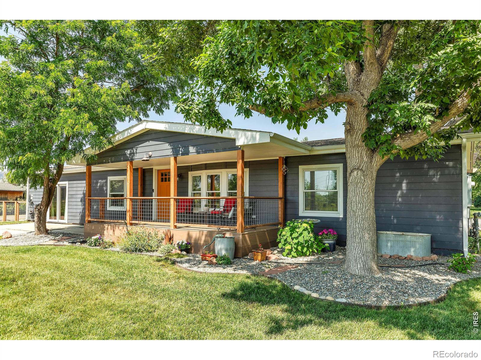 Discover a truly unique opportunity on 5 acres classified as mixed use Commercial/Residential, perfectly located between Sawhill and Walden Ponds with wildflower meadows and gorgeous views of the Flatirons and Indian Peaks. This versatile property, buffered from the road by wetlands that attract a myriad of birds and other wildlife, boasts a recently remodeled 1960 sf residence. Featuring 2 bed/2 bath + office, newer kitchen appliances, laminate flooring throughout, siding, and a new septic system that supports both the residence and the greenhouse. Spacious stamped concrete patio with sauna and pergola with gravel fenced in dog run for the four legged family members. Nearby 925 sf insulated and heated Quonset hut workshop for your projects and storage needs. The highlight is a 16,600 sf custom Nexus greenhouse facility, built in 2014, in excellent condition with numerous upgrades including all LED grow lighting. Wadsworth SEED environment control system, Svenson dual layer light deprivation curtains. Munters variable speed exhaust fans, Modine 93 high efficiency unit heaters, rolling benches and more. The facility is truly turn key for your growing business or lease it out generating passive income. Connected to the greenhouse is an expansive, acoustically treated flexible 1200 sf space that includes a surround sound system, programmable LED lighting, skylights, radiant heated cork floor, kitchen and bath- ideal for an office, studio or creative hub. Bring your dreams to life. Farm animals welcome. Go ahead. Let AI take your job. Move to the farm and have chickens and cows as your neighbors.