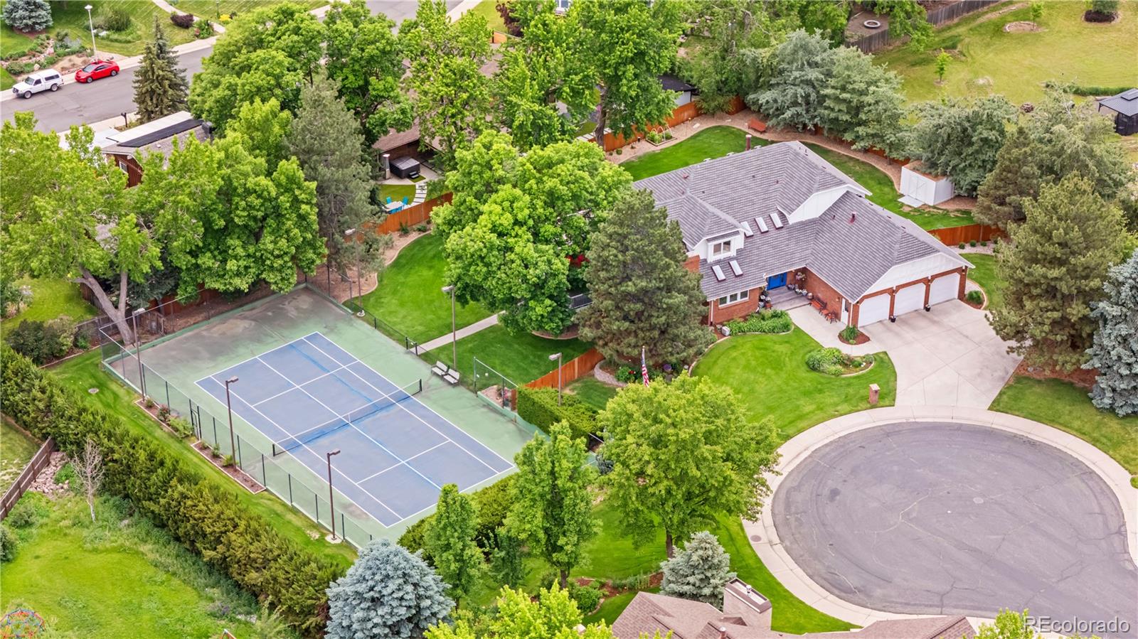 Stunning Custom Arvada Estate nestled on a lush 1 acre retreat in Arvada's prestigious Apex Park & Recreation District, this flawlessly renovated 7-bedroom (or six with 2 offices), masterpiece exudes timeless luxary.  Gleaming granite countertops adorn every surface, from the state-of-the art gourmet kitchen with premium appliances and custom cabinetry to elegant bathrooms, creating a seamless flow of sophistication.  Rich tile, bamboo, and cherrywood flooring, paired with fresh paint, infuse warmth and vibrancy throughout.   Generous bedrooms and abundant storage ensure effortless living.  Triple-pane windows flood the home with light while maintaining serenity complemented by new water heaters and modern AC/heating for year-round comfort, 2 Furnaces & 2 Air Conditioners,  Outside, a private tennis court, expansive deck, and meticulously landscaped yard frame breathtaking mountain vistas, perfect for tranquil evenings of vibrant gatherings.   An oversized 3 car garage provides ample space, while the prime locattion near top-rated schools and the scenic Ralston Creek Trail-offering easy biking or walking routes to Denver or Golden-blends peaceful retreat with urban access.   This radiant gem is a must-see.   Book your private tour today!!!