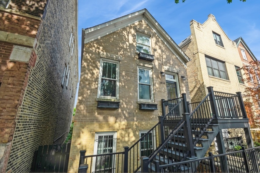 Get ready to live in a classic Bucktown 'workers cottage'. This all brick, 3 story single family home boasts on the main floor a large living room and spacious dining area with its charming original built in china cabinet, a modern kitchen with newer appliances, a full bathroom, the 3rd bedroom and a large deck. The primary and second bedroom-which has a large private balcony-are located on the top floor and each include beautiful custom built in cabinets. There also is a full bath, closets and side by side washer and dryer on this floor. The interior back stairs off the kitchen takes you down to the mud room and finished lower level which has a comfortable family room, full bathroom, a complete kitchen and the 4th bedroom. The lower level can also be entered by a separate front door. The mud room includes a stackable w/d and additional storage. The beautifully landscaped back yard with a brick patio will complete your private oasis in the city.  This home is located a short walk one of the best kept secrets-the Clybourn Metra station on the Union Pacific North train which is a 12 minute ride to the downtown Ogilve station. Need the northwest suburbs? You are in luck, the Union Pacific Northwest also stops here. The Damen bus is to the west a couple of blocks. Quick access to the highway using the Armitage ramps is nearby. The 606/Bloomingdale trail/bike path is 1/2 a block to the south.