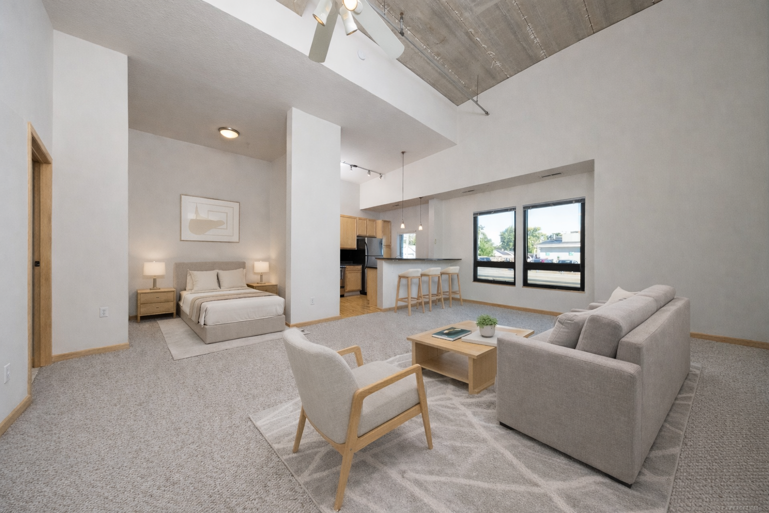 This beautiful condo is a standout with its soaring 16-foot ceilings and large windows that fill the home with natural light all day. This unit boasts one of the building’s top floor plans, a rare loft style design! The open layout and modern design create an inviting atmosphere.  Featuring an inviting kitchen peninsula that includes a breakfast bar. The oversized living room showcases wonderful views through the wall of windows. The spacious bedroom easily accommodates a king-sized bed and provides generous closet space. Additional highlights include in-unit laundry with washer and dryer, and a private storage locker close to the heated parking space. Building amenities include a community room, fitness center, car wash, convenient bike storage with direct outdoor access, and more! All this in a highly walkable location close to shops, restaurants, parks, and just a quick drive to the MOA and the airport.