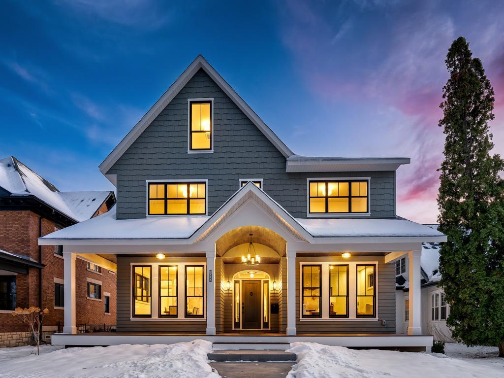 Exquisite new construction on an oversized 60'x150' lot in the heart of Macalester-Groveland.  Perfectly positioned on a serene one-way block, this exceptional home combines timeless architectural elegance with the finest modern comforts.  The main level showcases an open and inviting floor plan, featuring a chef's kitchen with a large center island, walk-through pantry, and a private office ideal for remote work.  A charming front porch extends the living space and enhances the home's classic curb appeal.  Upstairs, the impressive primary suite offers a luxurious retreat, accompanied by three bedrooms, two additional baths, and a spacious laundry room.  The third level provides an expansive family room complete with wet bar and guest suite - perfect for entertaining or hosting overnight visitors.  Set in one of St. Paul's most desirable neighborhoods, this home offers unbeatable access to both downtowns, the entire metro area, and the best of local living - just blocks from Summit Avenue, Macalester College, and the shops and restaurants of Grand Avenue.