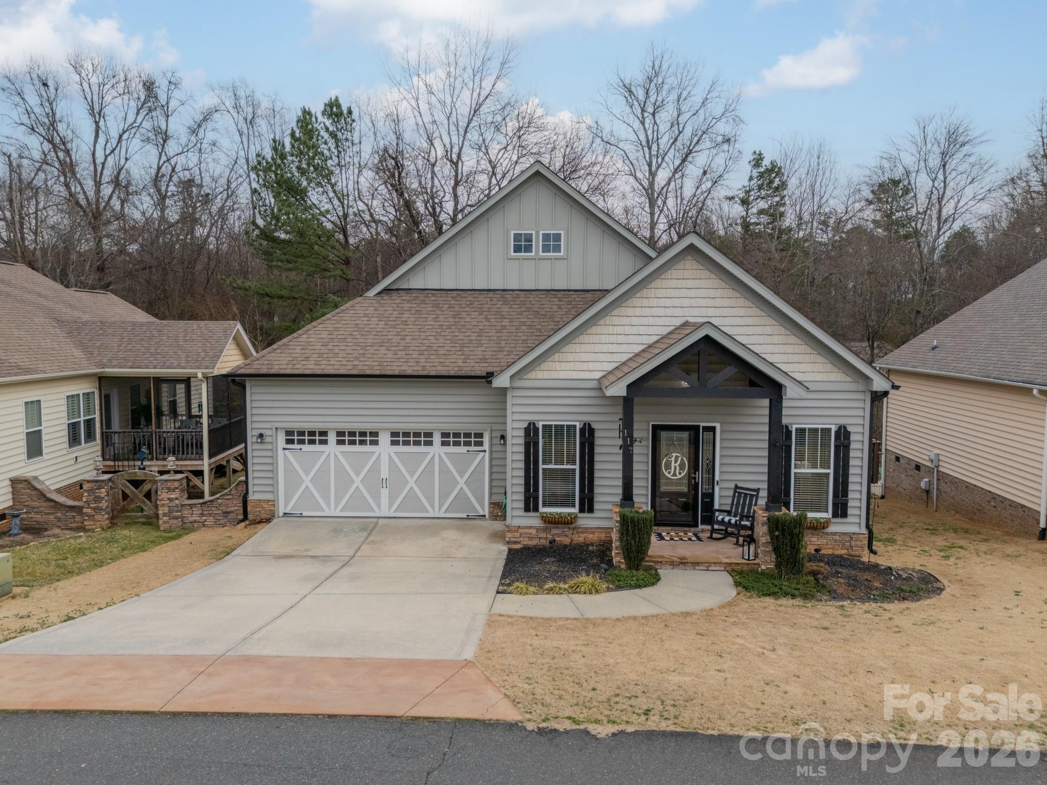 This charming 3-bedroom, 2-bath bungalow blends timeless character with modern style. Move-in-ready and thoughtfully designed, the home features beautiful LVP floors, granite countertops, and modern fixtures throughout. The open, functional floor plan offers an easy flow for everyday living and entertaining. The living room showcases a beautiful stone fireplace and tray ceiling, creating a warm and cozy focal point. The kitchen is well-appointed with modern cabinetry, ample counter space, pantry storage, and a spacious breakfast area. A versatile bonus room provides the perfect space for a home office, or additional living area.  Step outside to enjoy the deck-ideal for relaxing or hosting with an additional patio overlooking a private, tree-lined backyard. And an encapsulated crawl space to add efficiency. This is the perfect combination of comfort, style, and low-maintenance living. Home is located minutes from shopping, restaurants, golf, and a winery. 35 minutes from Uptown Charlotte.The home is available to people under 55 however this community has acceded the number of 55+ to get an exemption from fair housing familia status so anyone one under 18 are not allowed to reside per the CCRS
