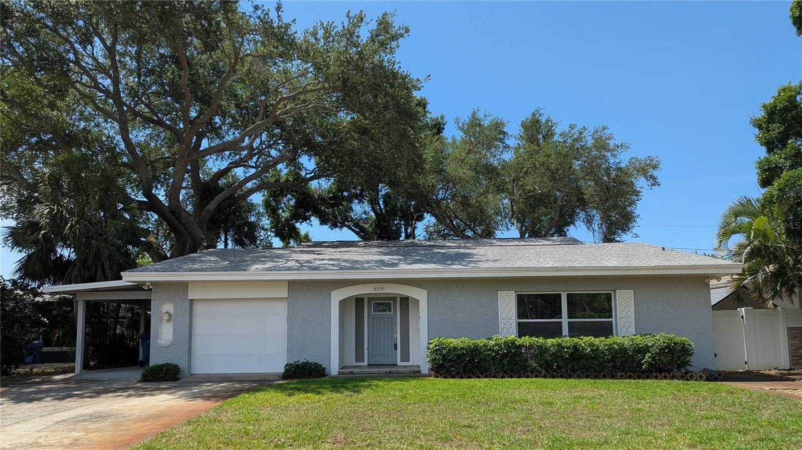 Substantial Price Improvement and Owner Financing Option Now Available! Extraordinary completely renovated residence on brick streets of desirable Eagle Crest has an expansive open floor plan and exceptionally spacious rooms. The stairway to the Second Floor is a modern showpiece with custom aluminum stair rail and hanging LED light fixture. Upgraded electric service, LED lighting fixtures throughout, two Rheem 15 Seer Heat Pump Systems, and a tankless natural gas water heater with built-in circulating pump create a modern energy efficient home. The Indoor Heated Salt Water Pool has a Stonescapes surface, glass waterline tile, deck pavers and coping, and a pump/filter/skimmer. Double Primary Bedrooms with En-suite Bathrooms, one on First Floor and one on Second Floor, would be ideal for a multi-generational family.  French doors open from the Living Room and First Floor Primary Bedroom to the Pool Area which will be an oasis and retreat for all seasons. There is easy access from the pool area to the private fenced back yard through hurricane-rated sliding glass doors. The Kitchen features solid wood cabinetry, DuPont Zodiaq Quartz countertops, stainless-steel appliances, glass tile backsplash, brushed nickel hardware, and a unique large custom movable island on casters. All full bathrooms include Carrera marble and glass tile, glass shower enclosures, rain showerheads, single handle ribbon faucets, coordinated brushed nickel fixtures and hardware, and freestanding vanities with an open shelf and matching mirrors. This home defines the WOW Factor!
