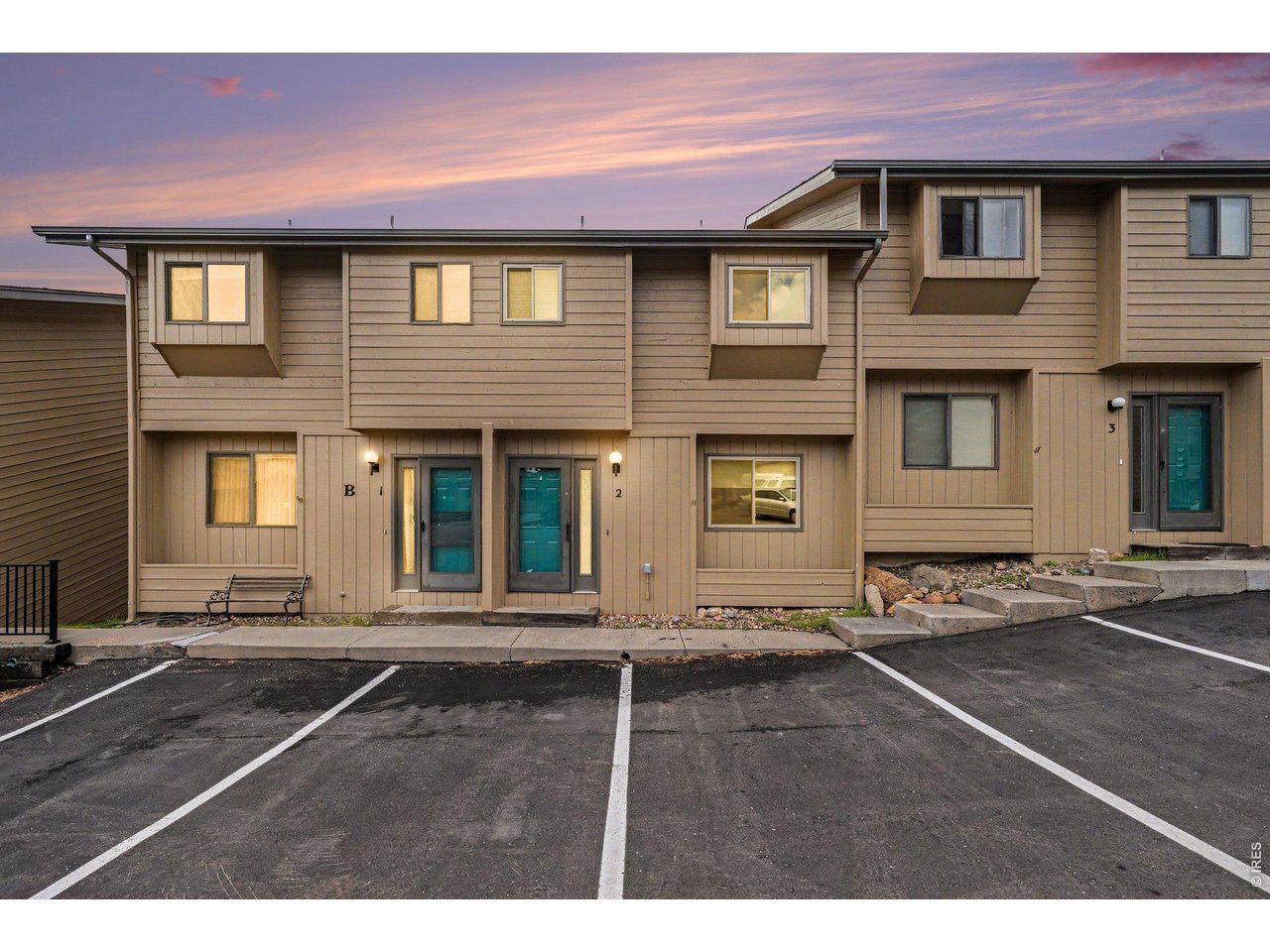 Welcome to 514 Grand Estates Drive, Unit B-2, a updated 2-bedroom, 2-bath condo in the heart of Estes Park. This home hits that sweet spot between mountain comfort, easy living, and not spending every weekend maintaining something with "character." Inside, you'll find a bright, open floor plan with vaulted ceilings, great natural light, and a cozy wood-burning fireplace, perfect for those Estes Park evenings when the temperature drops and everyone suddenly remembers they own fuzzy socks. Recent updates include new flooring, fresh paint, and an updated backsplash, giving the home a clean, refreshed feel while keeping its mountain charm. The kitchen offers good cabinet space, a breakfast bar, and an easy flow into the dining and living areas. With no neighbors above or below, this unit offers a quieter, more private feel than many condo options. Outdoor spaces give you room for morning coffee or simply watching Estes Park do what Estes Park does best: mountain views, fresh air, and the occasional wildlife cameo. The main-level primary suite includes a walk-in closet and access to a fenced patio, ideal for pets. The second bedroom also has a walk-in closet and works well for guests, a home office, or all the outdoor gear that mysteriously multiplies near Rocky Mountain National Park. Additional features include convenient laundry, storage, dedicated parking, and a low-maintenance setup close to Lake Estes, downtown Estes Park, hiking, biking, fishing, and wildlife watching.Whether you're looking for a full-time residence, weekend getaway, or comfortable Estes Park basecamp, 514 Grand Estates Drive, Unit B-2 offers location, comfort, updates, and that easy mountain lifestyle buyers are always hoping to find.Don't miss your chance to own a slice of Estes Park.