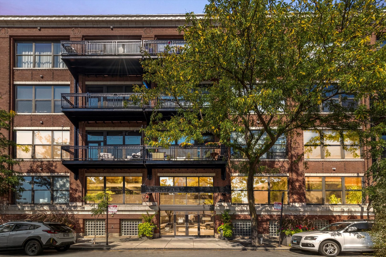 Located in one of the West Loop's premier full-amenity buildings, this 2BD + Den, 2BTH penthouse-level loft offers soaring timber ceilings, hardwood floors throughout, and a balcony with tranquil courtyard views. The open-concept layout is ideal for entertaining, with a spacious island kitchen, pantry, and stainless steel appliances. Enjoy full-service living with 24-hour door staff, a fitness center, yoga studio, theater, business center, and an expansive community lounge with outdoor terrace and grills.  Enjoy the proximity to Fulton Market, the Loop, restaurant row, CTA, Metra, and major expressways. Zoned within the highly rated Skinner West, this home combines design, function, and an unbeatable West Loop location. First-floor garage parking available for $25K.
