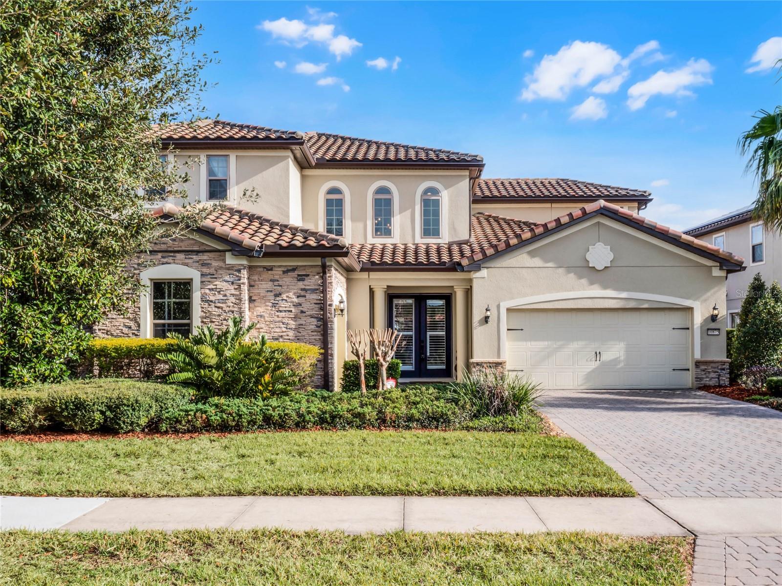 Exquisite Executive Residence in The Enclave at Lake Nona. Used as a vacation/ second home for this owner. 

Discover luxury living at its finest in this stunning Transitional Mediterranean estate, situated in the remote guard gated community of The Enclave in Lake Nona. This beautifully designed five-bedroom, five-and-a-half-bathroom residence offers an exceptional and very flexible floor plan, including a massive 1st floor owner’s suite and guest ensuite, a private study (in addition to 5 beds) and a dedicated pool bath. 

Formal dining for entertaining, leading into an incredible Great room with soaring ceilings washed in Florida Sunshine.  A custom gas fireplace with a granite and wood surround, flanked by soaring bookshelves, serves as the centerpiece of this expansive space. The kitchen is the true heart of this masterpiece. It does not disappoint with a massive island for gathering, more counter space and cabinet storage than you will ever need. Natural gas cook top with vented hood and closet pantry for all your staples.

Elegant Old World-inspired ceilings, adorned with exposed beams, planks, and travertine stone, create a warm and inviting ambiance. New Designer lighting enhances both the interior and outdoor living spaces, while no rear neighbors ensure the ultimate in privacy and tranquility.

Upon entering the double door front  entry, you are greeted by a soaring vaulted entryway and a signature wrap around espresso-stained wooden staircase leading to the second level, which features a spacious recreational/bonus room and three additional oversized bedrooms . One is a second primary with own bathroom and walk in closet. 

Designed for seamless indoor-outdoor entertaining, this home boasts an expansive outdoor oasis complete with a heated pool, spa, lush privacy landscaping, and a summer kitchen equipped with a built-in grill and refrigerator. The open-concept great room features fully retractable sliding glass doors, allowing for effortless access to the outdoor retreat.

This residence is being sold fully furnished and has been used as a second home by the current owner, making it a rare turnkey opportunity for one lucky buyer.

The Enclave at Lake Nona offers residents exclusive access to premium amenities, including 24-hour gated security, professional landscaping services INCLUDED, internet, cable , alarm monitoring and access to Village Walk’s resort-style recreational facilities—featuring a lap pool, family pool, fitness center, tennis and basketball courts.

Ideally located just minutes from Medical City, the USTA National Campus, premier dining, and Orlando International Airport, this home offers both convenience and luxury, all within the beautifully maintained and tranquil surroundings of Lake Nona Boulevard. New Advent Health Hospital already broke ground less than a mile away as well, making this the ideal commute for any medical professional.

Experience an unparalleled lifestyle in this exquisite Lake Nona estate—schedule your private tour today!