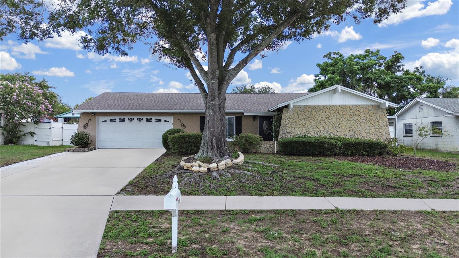 This pool home is light and bright with on outdoor kitchen located in the heart of Brandon on a spacious 0.25 – acre lot for outdoor fun.  You will enjoy the sparkling salt system pool and deck.  There is newly re-finished flooring in the kitchen, dining and great room.  The double pane insulated windows bring peace and quiet into this home with lower cost energy efficiency in the great room.  The kitchen is a culinary dream come true.  There is a double oven range with an additional built-in oven and upgraded beautiful kitchen cabinetry and granite countertops with spacious island.  There is plenty of space for cooking and entertaining. Both bathrooms have been remodeled.  The master bath tile is fitted from floor to  ceiling.  The great room has a beautiful brick wood burning fireplace with built – in book shelves for your reading pleasure. Good information to know about this home:  NEW ROOF installed June 2025; New living room carpet - June 2025; Septic pumped  - June 2025 New pool pump – 2023; pool liner 2020; salt system – 2022; air conditioner - January 2021; waterless hot water heater - 2021. Located close to Kingswood Elementary and minutes from parks, Brandon Mall, Brandon Hospital, top dining and the expressway.  This home provides easy access to Tampa and MacDill.  No HOA or deed restrictions gives you freedom to make this home yours.