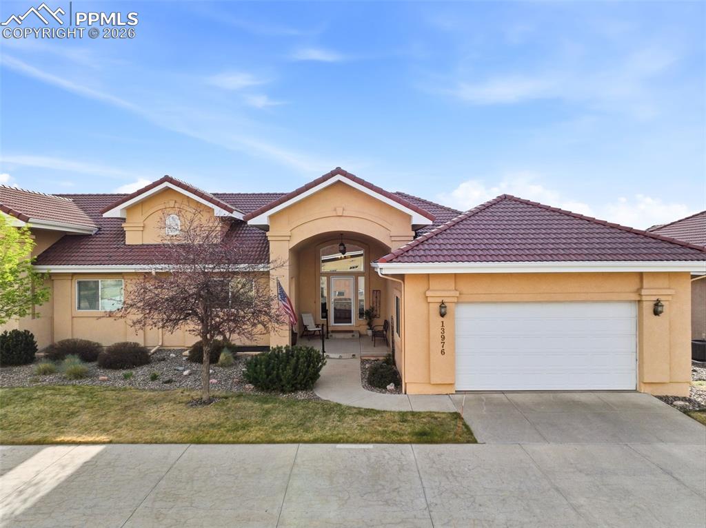 Welcome to this meticulously maintained 3 bedroom, 4 bath, 2 car garage rancher in the prestigious gated community of Paradise Villas. Ideally situated to capture sweeping views of Pikes Peak and the United States Air Force Academy, this exceptional patio home offers more than 3,700 square feet of thoughtfully designed living space. Inside, an open and inviting floor plan welcomes you with a spacious great room anchored by a cozy gas fireplace and custom built-ins. A dedicated main-level office or music room creates the perfect work-from-home space, while the nearby powder bath adds convenience for guests. The kitchen flows effortlessly into the dining and great room areas and features granite counters, a hightop bar, generous storage, maple cabinets, and a walk-in pantry. Venetian plaster enhances many of the rooms, adding richness and character throughout the home. A spacious main-level laundry room adds everyday convenience. The main-level primary suite offers a peaceful retreat with a luxurious 5-piece bath, expansive walk-in closet, and private access to the back patio that is perfect for enjoying Colorado’s beautiful mornings and mountain views. Downstairs, the finished basement expands the home's versatility with a wet bar, spacious family room, and rec area ideal for entertaining, casual dining, or game nights. A flexible office, craft, or work-out room provides additional options to fit your lifestyle. Two spacious  and luxurious bedrooms share a Jack-and-Jill bath with dual vanities, and an additional half bath completes the lower level. Recent updates include a newer furnace and air conditioning system for added year-round comfort and peace of mind. Enjoy low maintenance living in one of northern Colorado Springs’ most sought-after gated communities, known for its tranquility, location, and breathtaking Front Range views.