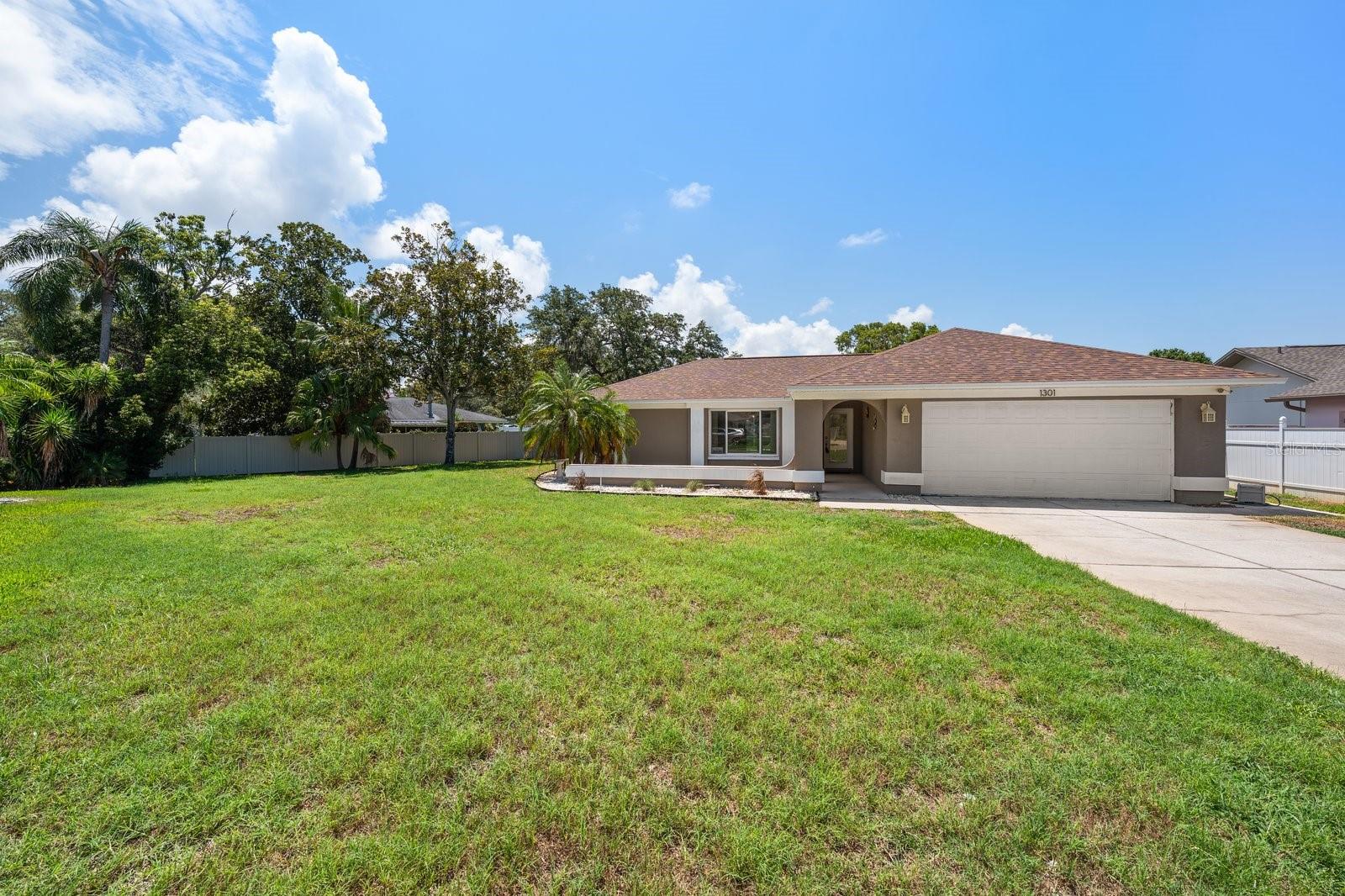 Under contract-accepting backup offers. Virtually Staged. Exceptional opportunity to own this solid block pool home situated on an oversized .35-acre cul-de-sac lot with NO HOA and located in a non-flood zone. Offering the perfect combination of space, functionality, and peace of mind, this residence features 3 bedrooms, 2 full baths, and a desirable two-way split floor plan designed for comfortable everyday living. The layout includes two separate living areas, providing flexibility for entertaining or creating a home office or media space. Three sets of sliding glass doors seamlessly connect the interior to the screened outdoor living area, making it easy to enjoy Florida’s indoor-outdoor lifestyle. The private primary suite is tucked away from the secondary bedrooms and offers direct access to the pool, along with an en suite bath. The guest bedrooms are generously sized and share a full bath with a tub/shower combination. An inside laundry room adds to the home’s convenience. Step outside to your screened saltwater pool, complete with a newer screen enclosure, offering the perfect setting for year-round enjoyment. Major system updates have already been completed, including a new roof (2025), A/C (2020), hurricane-impact windows and sliding glass doors, newer electrical panel, newer water heater, and water softener. The irrigation system is supplied by a private well, helping keep landscaping costs low. With all the major improvements already in place, this home offers an outstanding opportunity for its next owner to personalize the cosmetic finishes and create their own vision, while enjoying the confidence of updated mechanical systems and an exceptional location.