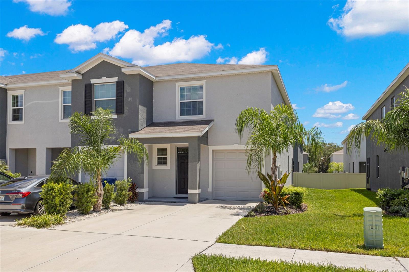 Welcome to this stunning, move-in-ready end-unit townhome located in the highly desirable Summerstone Community! This 3-bedroom, 2.5-bath home offers a perfect blend of modern luxury and thoughtful design, starting with elegant tile flooring that flows throughout the entire main level. The gourmet kitchen is a chef’s dream, featuring 42" espresso cabinetry with crown molding and soft-close drawers, premium quartz countertops, a large pantry, and a full suite of stainless steel appliances. Seamlessly transition through the sliding doors to your private screened lanai, complete with charming string lights—perfect for relaxing evening hangouts. Upstairs, you’ll find a highly functional split-bedroom layout centered around a versatile flex space, which is ideal for a second living area, media room, or play space. The primary suite serves as a true retreat, featuring dual closets with custom built-in organizers and an ensuite bath with dual sinks and ample cabinetry. The secondary bedrooms share a convenient Jack-and-Jill bath, and the upstairs laundry closet comes fully equipped with a washer and dryer. Completing this home is a 1-car garage with epoxy flooring and overhead storage racks, a water softener, and access to community amenities including a resort-style pool, clubhouse with luxury outdoor seating, and dedicated cooking/grilling areas. Additional features of the community include basketball courts, open recreation areas, a playground, and a community dog park, as well as sidewalks, walking trails, park areas, and a pavilion. This home truly has it all!