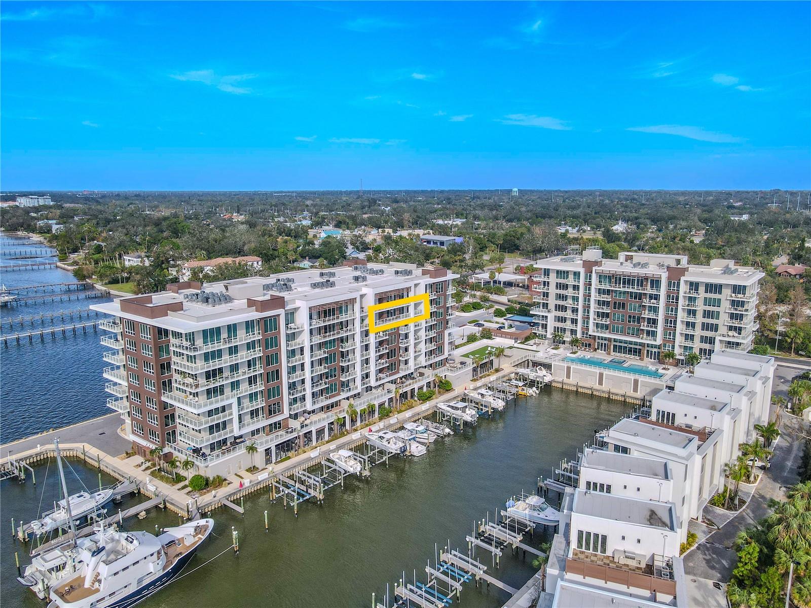 Virtually Staged. EXCEPTIONAL WATERFRONT CONDO IN CLEARWATER, FLORIDA! Experience refined coastal living in this exceptional 7th-floor residence within Clearwater’s premier waterfront community, Marina Bay. This 3-bedroom, 4-bath condominium combines elegant design, modern construction, and resort-style amenities with stunning views of the Intracoastal Waterway and marina.A spacious, open, split-floor plan welcomes you with large-format tile flooring and expansive living and dining areas. Floor-to-ceiling, hurricane-rated windows and glass doors flood the home with natural light while showcasing panoramic water and skyline views. Electric window shades throughout add effortless comfort and privacy.The gourmet kitchen features sleek cabinetry, quartz countertops, and an oversized island with seating, framed by elegant crystal pendant lighting. The kitchen is outfitted with a full suite of premium stainless-steel appliances, including a French door refrigerator, wall oven, dishwasher and built-in microwave. A custom walk-in pantry includes pull-out drawers, adjustable shelving, and closed cabinetry designed for organization and ease.The primary suite exudes understated sophistication, complete with a spa-inspired bath featuring dual vanities, polished quartz counters, a frameless glass shower, refined designer fixtures, a private water closet, and a freestanding soaking tub that serves as the elegant focal point. Each additional bedroom includes its own ensuite bath with contemporary tilework and modern finishes, ensuring privacy and comfort for family or guests.Additional highlights include a spacious laundry room, multiple storage options, and two assigned parking spaces (#88 and #45) in the secure, gated underground garage. The property also provides electric vehicle charging stations for convenience and sustainability.Enjoy an impressive collection of resort-style amenities: a 25-meter heated saltwater lap pool with spa and two baja shelves, fitness center, sauna, steam room, putting green, and a stylish clubroom with catering pantry. The waterfront promenade and private marina create an ideal setting for evening strolls or sunset views.Built to the highest standards, Marina Bay features sound-insulated construction and top-quality hurricane-proof windows and doors. Expansive terraces with glass railings maximize views of the Intracoastal and marina. Residents enjoy a 24/7 concierge service, a full-time on-site property manager, and secure access for added peace of mind.Located just minutes from Clearwater Beach and downtown, this residence captures the best of luxury coastal living — modern elegance, convenience, and breathtaking water views in every direction.