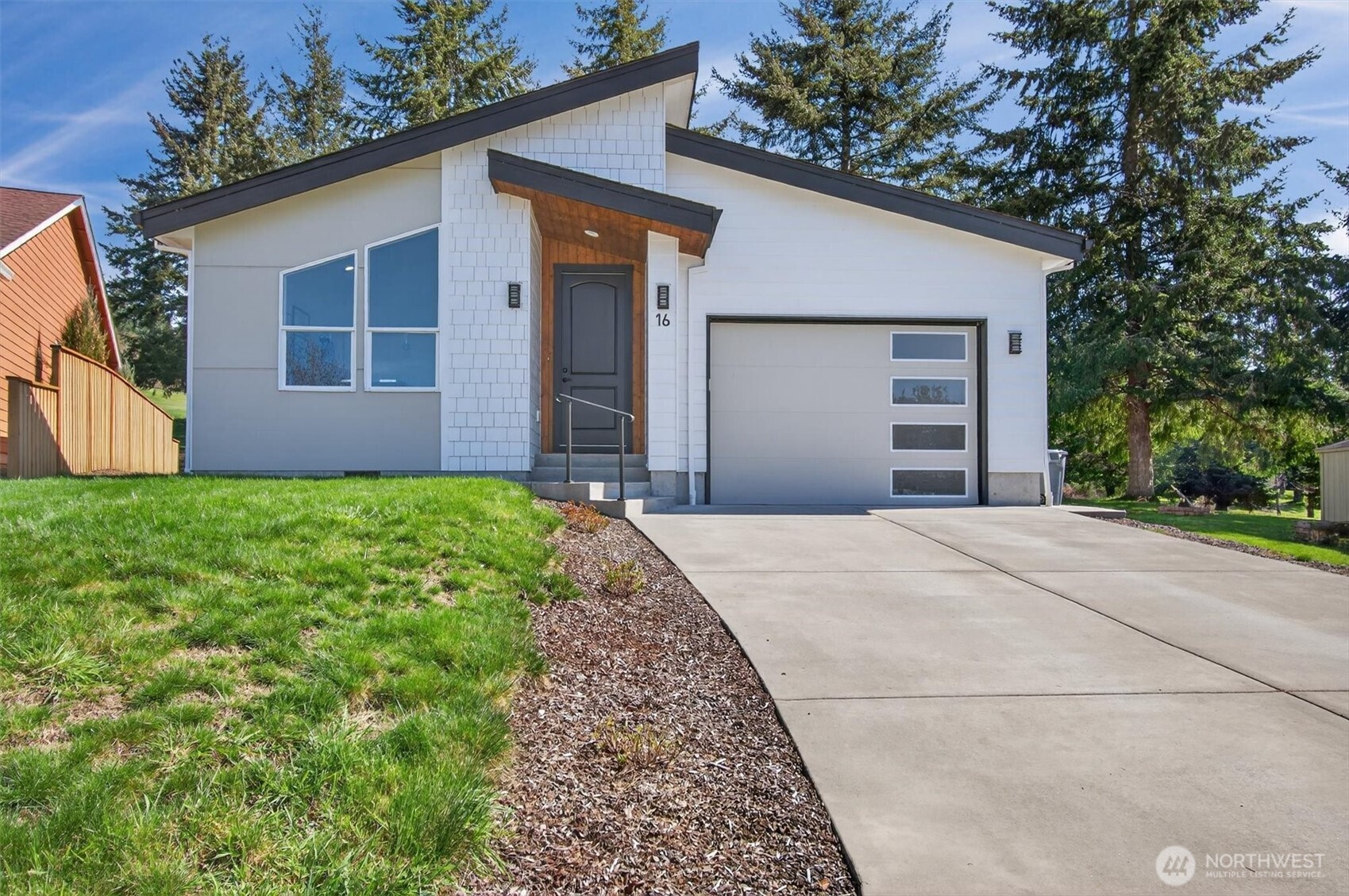Welcome to your peaceful retreat along the fairways, where modern design meets the natural beauty of the Pacific Northwest. Built in 2023, this 2-bedroom, 1.75-bath NW Contemporary home offers 1,265 sqft of thoughtfully designed living space in a quiet golf course neighborhood near the Columbia River. Step inside and you’ll immediately feel the openness of the light-filled interior. Large windows invite the outdoors in, creating a seamless connection to the surrounding landscape. Electric blinds allow you to easily control light and privacy. Engineered hardwood floors run throughout adding warmth and durability. At the heart of the home, the kitchen features granite countertops, soft-close cabinets, and stainless steel smart appliances. Whether cooking breakfast or hosting a dinner party, this space is equipped to handle it all with ease. The primary bedroom offers a peaceful escape with its own bathroom and walk-in shower. A 2nd bedroom provides flexibility for guests, a home office, or whatever suits your lifestyle. Outside, enjoy the new Trex deck—ideal for morning coffee or evenings with friends while taking in the serene golf course setting. The fenced yard adds space for pets, gardening or outdoor entertaining. Located in a welcoming rural community, you’ll appreciate the slower pace of life while still being within easy reach of the Coast, Astoria, and Portland. This home offers comfort, style, and a truly tranquil lifestyle. Don't miss out! Schedule your tour today!!