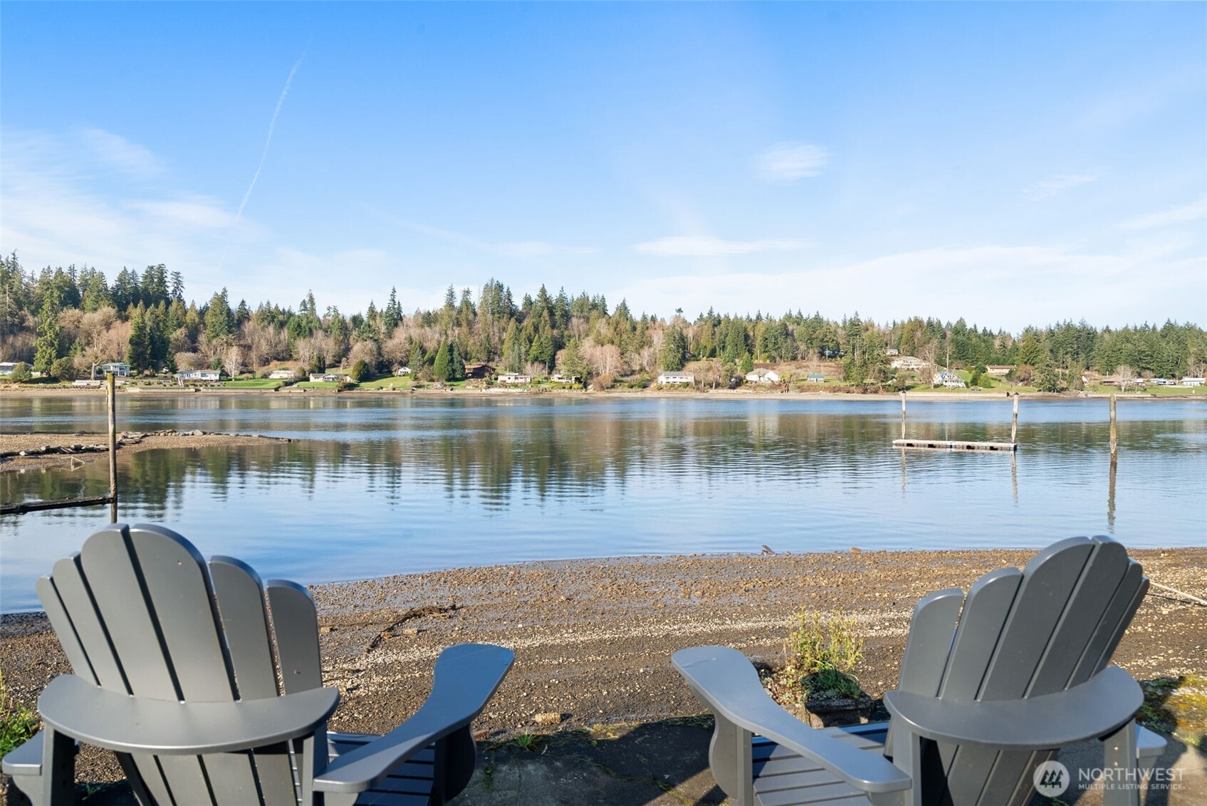 Experience the rare synergy of expansive acreage and pristine shoreline with this exceptional 3.11-acre SALTWATER home. Perfectly positioned on a vibrant working inlet, this property offers a front-row seat to the majesty of the Pacific Northwest, from frequent JPod Orca sightings to the convenience of harvesting fresh oysters and clams from your own backyard. The residence features a versatile layout with four bedrooms, 2 of them on the MAIN, a spacious kitchen designed for entertaining, and a cozy wood-burning stove for cool coastal evenings. Outside, a massive waterside deck overlooks nearly 100 feet of private beach, while the grounds boast a thriving orchard of apple, fig, and plum trees, a chicken coop, and a garden ready for your touch. Modern essentials are already in place, including a newer septic system, private well, and high-speed internet, complemented by a massive pole carport and a partial basement for abundant storage. MOORING bouy anchor; floating dock platform and the rare potential to develop a second homesite, this is more than a home—it is a high-value investment in a lifestyle of adventure and privacy. Whether you are watching seals from the deck or planning your future estate, this unique offering represents an incredible bargain in a competitive waterfront market.