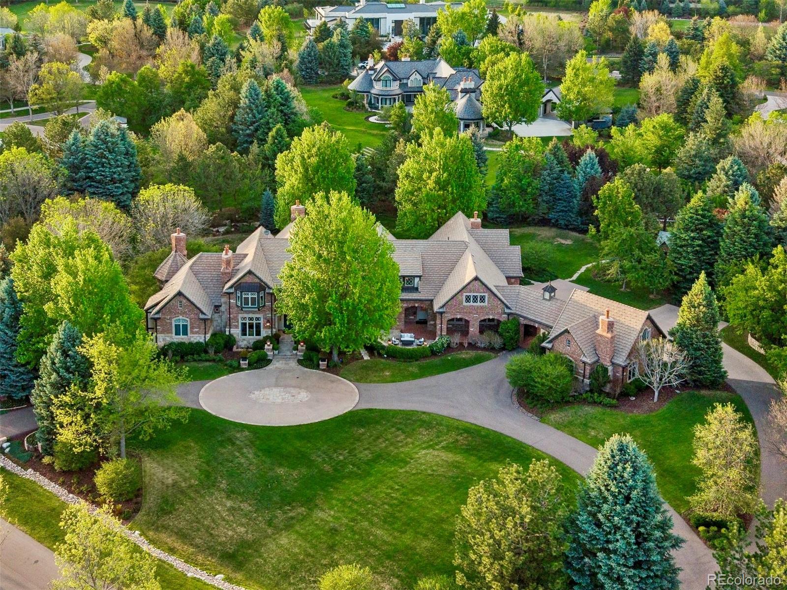 Welcome to 26 Cherry Hills Park Drive, a timeless residence where classic elegance meets thoughtfully curated modern living. Tucked within the guarded and gated Cherry Hills Park. The traditional exterior offers enduring curb appeal and opens to a warm, inviting interior that has been completely reimagined. With 6 bedrooms and 8 bathrooms, every detail has been carefully selected to create a refined yet comfortable atmosphere, perfect for both everyday living and elevated entertaining. The 6th bedroom is currently being used as a gym.The heart of the home is the stunning kitchen, featuring a coveted double-island layout that provides exceptional functionality and gathering space. Designed to impress while remaining highly practical, the kitchen flows seamlessly into light-filled living areas that feel both luxurious and welcoming.Throughout the home, designer finishes, cohesive textures, and a soft, sophisticated palette create a sense of calm and understated elegance. The layout offers effortless flow and intimate spaces alike, making the home equally suited for quiet evenings or hosting family and friends.Outdoors, the ample backyard is an entertainer’s dream, with generous space for dining, relaxing, and enjoying Colorado’s beautiful seasons. The traditional architectural style paired with thoughtfully designed outdoor living areas creates a true extension of the home.26 Cherry Hills Park Drive offers the rare combination of high-end design, timeless character, and livable comfort—an exceptional opportunity in a coveted setting.