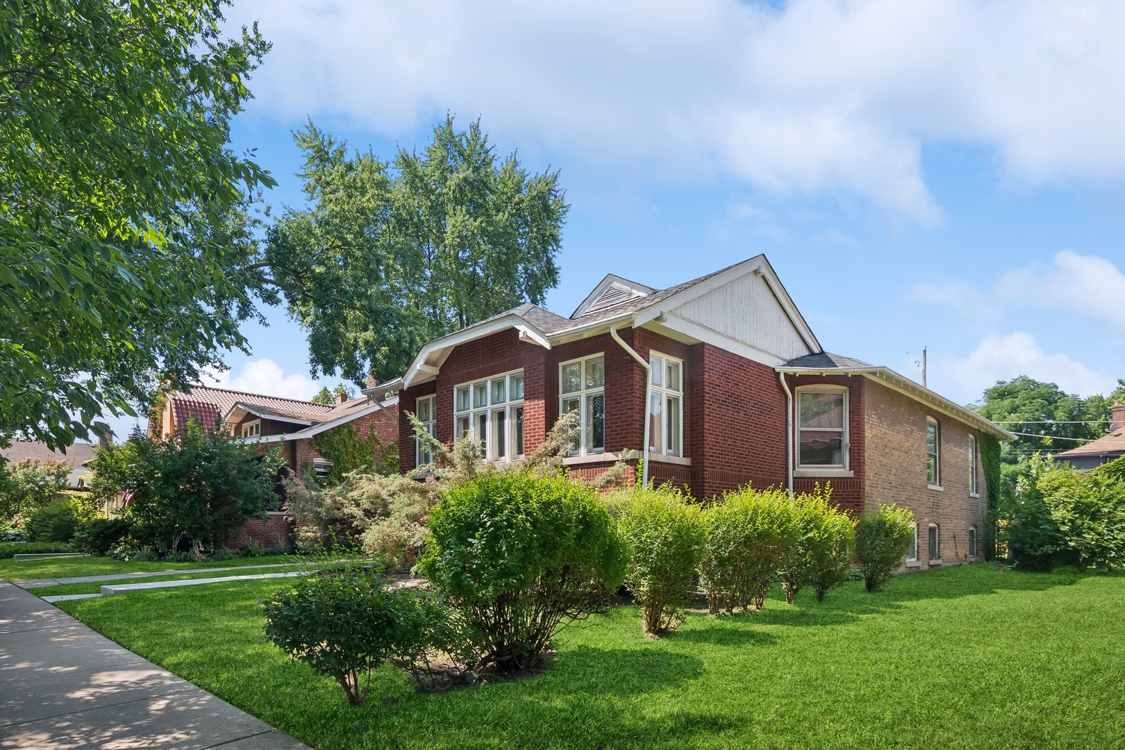 On the market for the first time in over 60 years, we are proud to present this beautiful and classic brick bungalow in Chicago's smallest historic neighborhood, The Villa. An absolute love house and one of just 121 historically protected homes, this property has been doted upon and meticulously cared for on a gorgeous oversized 50 x 114 foot lot. All of the original details have been preserved including ornate trim, doors and millwork, leaded glass windows and cabinetry, and fantastic vintage kitchen and bath tiles- not to mention the violet and robin's egg blue diamond patterned penny tile foyer. Many functional updates throughout the years make this home ready for occupancy including newer boiler (2017), (central) a/c unit(2022), concrete poured driveway, walkways and front porch ++. The lower level has its own entry, high ceilings and nice sized windows for ample light. Endless opportunities to create in law/ guest suite or keep as is currently 4th bedroom and additional family room. HUGE backyard to create the garden of your dreams. Nestled in between Old Irving Park and The Kennedy, The Villa is conveniently located just steps to the Addison blue line. Come and see what all the excitement is about. We look forward to your visit!