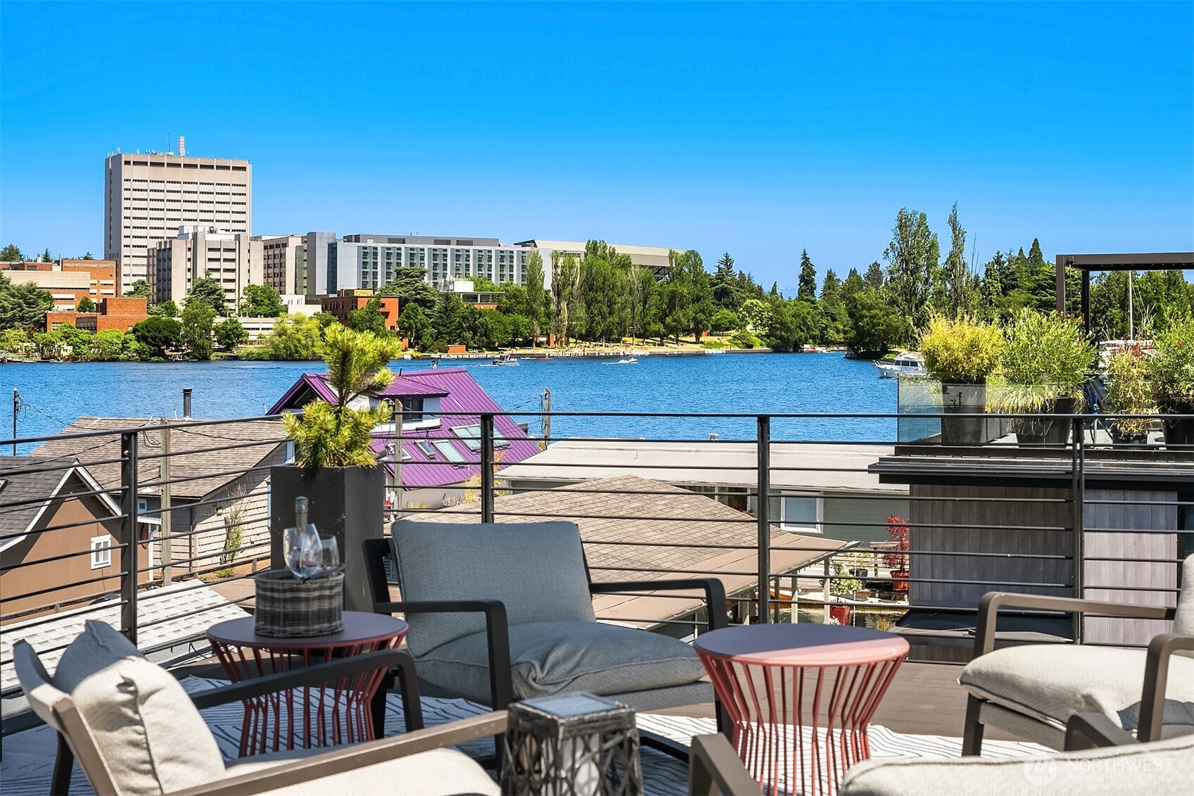 On Portage Bay’s sought-after Gold Coast, this Northwest Contemporary offers a lifestyle of ease and inspiration. From sunrise to sunset, enjoy panoramic water views from your expansive rooftop deck or launch straight into adventure from your private boat slip. Indulge in 3 levels of refined living with top-tier integrated appliances, Smart home automation, and a state-of-the-art Theater. Open living on the upper level is highlighted by Fleetwood doors and walls of glass framing the water in every direction. With unparalleled separation from the neighboring homes and an extremely rare private garage, this one of the rarest floating homes in the region. This is life on the water, reimagined in one of Seattle’s most coveted enclaves.