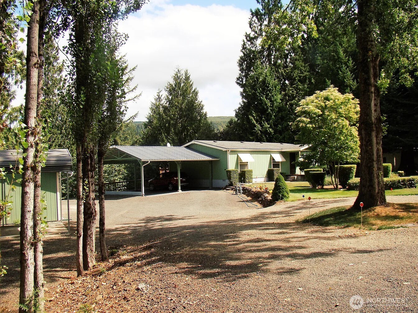 1.56 acres living in the countryside of Mossyrock. Two-bedroom two bath. There is a two-car carport (12x26) or perfect space for a boat.  28x48 Garage/shop with gas propane heater, there is space in the shop that could be used as a bedroom or playroom, craft room. The yard is fully fenced. Some features include a heat pump, City water $54.09/month, septic, the back deck is private with a view of privacy trees. All appliances included. The lake is only a few minutes away. Mossyrock is near. The area has plenty of outdoor recreational activities. I-5 is about a 20 minute drive away.