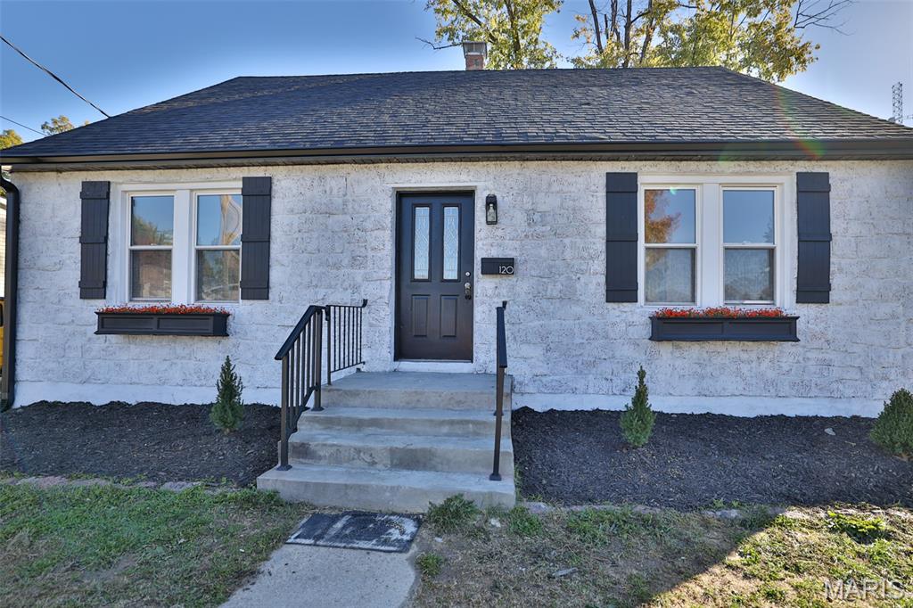 This charming, updated 4-bedroom, 3-bath home is located in the heart of Columbia. Step into the welcoming two-story foyer with a wood ceiling and chandelier, opening to a spacious living room and kitchen—perfect for entertaining family and friends. The newly remodeled kitchen boasts quartz countertops, a center island, and stainless steel appliances, making it ideal for holiday dinners. The main floor features two bedrooms and a full bath, while upstairs you'll find two more spacious bedrooms and a half bath. The lower level offers a recreational space and a full bathroom, as well as a laundry area with additional storage. A detached one-car garage and a large, level backyard complete this beautiful home.