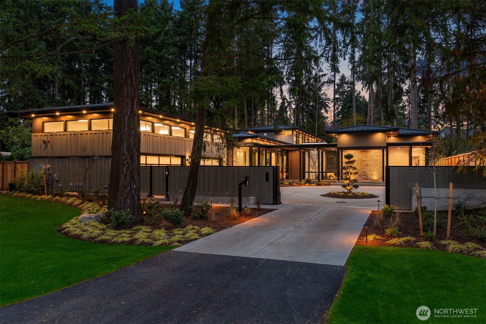 Bylington Development presents the "Forest House". A refreshing style rarely seen in new construction inspired by the rich and deep history of Japanese influence on Pacific Northwest architecture. A quiet and calming style of luxury craftsmanship that understands the natural world is a source of peace and inspiration. From the moment you step into the foyer you will notice the meticulous attention to detail that can only be attained by experienced and highly trained artisans. Primary suite on the main floor, great room with 14' ceilings, formal dining, and "Dojo". 6 ensuites plus loft. All-season, outdoor covered patio, gated auto-court, and 4 car garage can be expanded to 8 with lifts. Coveted Bellevue schools, minutes to downtown Bellevue