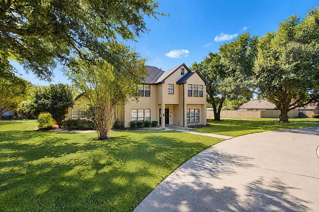 Situated on a rare one-acre parcel in a serene Frisco enclave with no HOA, this exceptional brick residence seamlessly merges modern luxury with wide-open space. An impressive circle drive and curated stone hardscape set an elegant tone, while earth-tone limewashed brick and abundant natural light create a warm, sophisticated ambience throughout. Designed for effortless living and high-end entertaining, the main level features luxury vinyl plank flooring, a sunlit family room anchored by a floor-to-ceiling marble-tiled linear fireplace, and sweeping views of the outdoor oasis. The chef’s kitchen is a masterpiece of design, showcasing dual-toned ceiling-height cabinetry with glass accents, glass subway tile, pristine granite countertops, a ceramic apron sink, and state-of-the-art stainless steel appliances including an induction cooktop. The main-floor owner’s retreat offers a private sanctuary complete with two oversized closets, an adjoining bonus room ideal for an office or gym, and a spa-inspired bath featuring a deep soaking tub, seamless glass shower, and dual vanities. Upstairs, four generously sized bedrooms are appointed with plush carpet, custom window seating, built-in desks and shelving, and two beautifully updated Jack-and-Jill baths. Outdoors, the resort-style pool, sprawling covered patio, and vast lawn provide an idyllic backdrop for year-round relaxation, with unlimited space for customization. Enjoy unmatched privacy and space just minutes from historic downtown Frisco, top-rated Frisco ISD schools, and premier parks. This is a truly remarkable property that must be experienced in person to be fully appreciated.