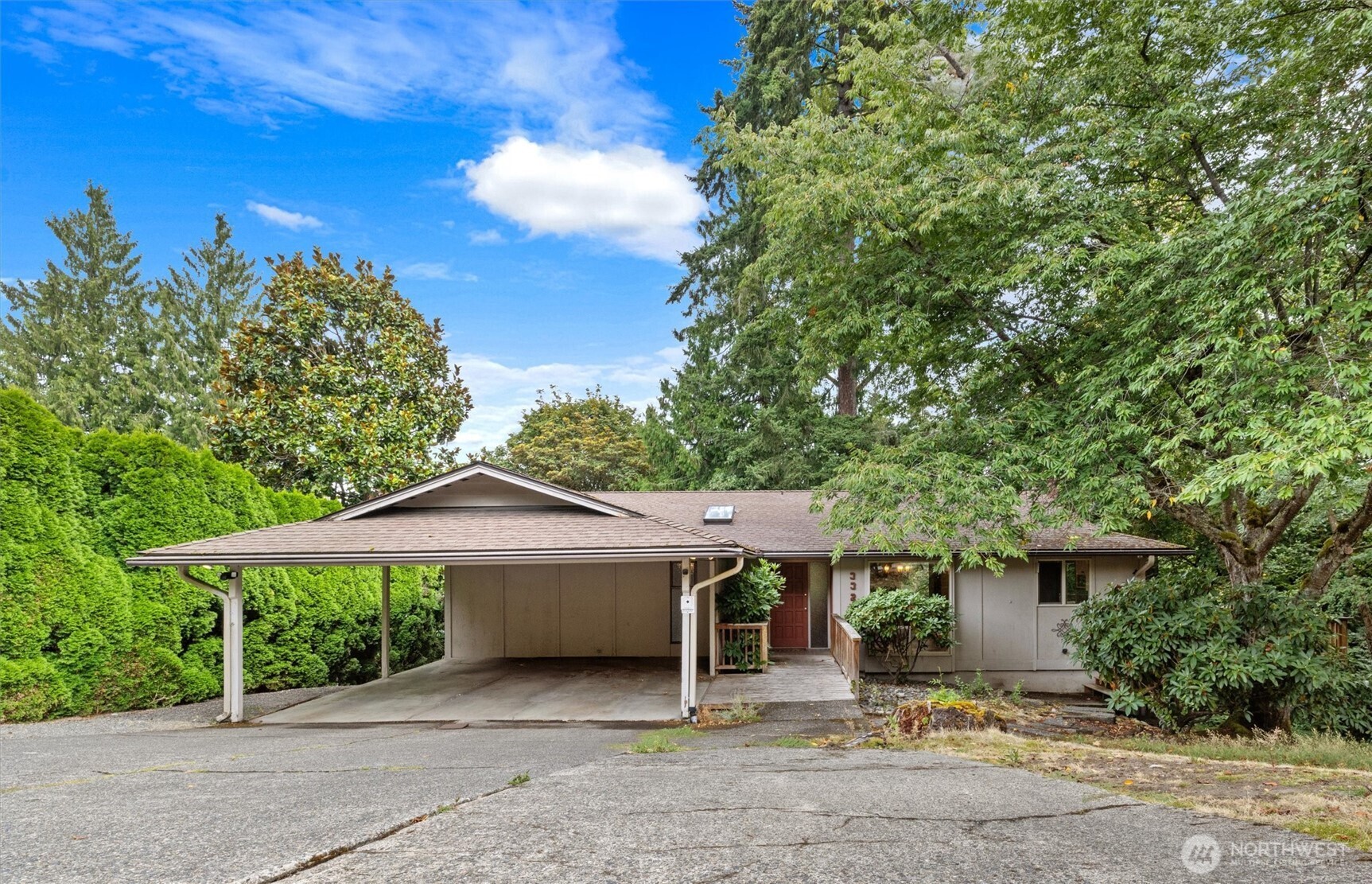 First time on the market in nearly 50 years, this kind of opportunity rarely comes along in coveted Clyde Hill. Tucked down a private drive on nearly ½ an acre, this 3,000+ sqft home offers privacy, wooded surroundings & a greenbelt backdrop, w/endless potential to reimagine, renovate & make it entirely your own! Move in now & update over time, or bring your vision for a full transformation. Spacious entry welcomes you w/a large dining rm connecting to the kitchen, just waiting to be opened into a true open-concept layout. Expansive great rm is anchored by a stone wood-burning fireplace, while walls of windows wrap the corner drawing the outdoors in. Off the kitchen, a deck extends your living space for dinners, entertaining & quiet evenings outside. Down the hall 2 generous bedrms, including 1 w/a skylight, full bth & the primary suite w/abundant closet space + ¾ bth. Downstairs brings even more possibilities w/a bonus rm ideal for an office, playroom or add'l flex space. An oversized bedrm leads into a 2nd living rm w/another wood-burning fireplace + slider to the backyard. Don't miss the laundry rm, ¾ bath & add'l bedrm before finding a large storage rm that could become an incredible theater, gym or studio. Turnkey enough to enjoy today, w/bones, space & setting to create something truly special. For added peace of mind: PRE-INSPECTED & 1-YEAR HOME WARRANTY. Near top-rated schools, shopping & easy commuting. Bring your imagination & make this Clyde Hill classic your own!!