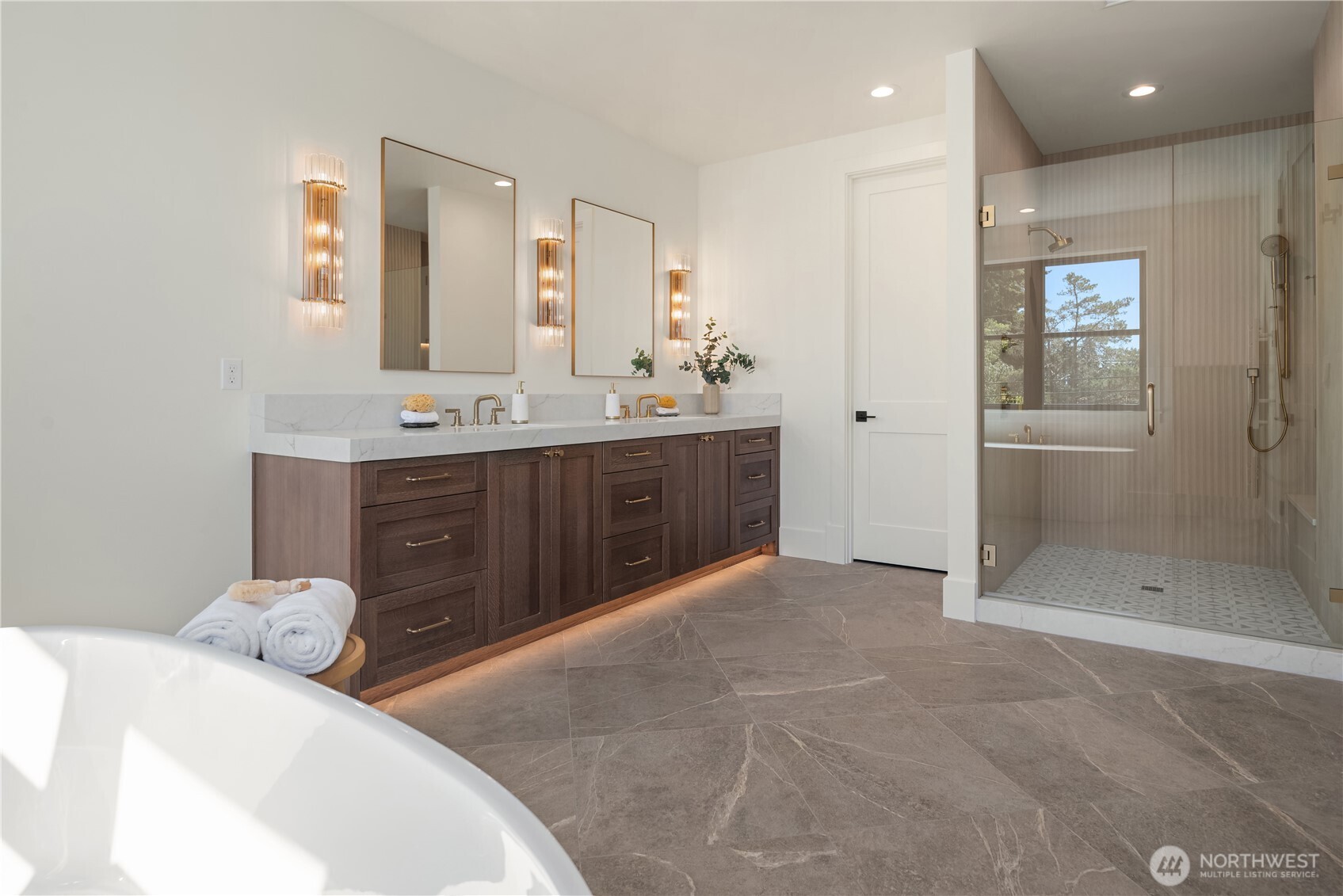 Oversized walk-in shower completes the spa-like ensuite