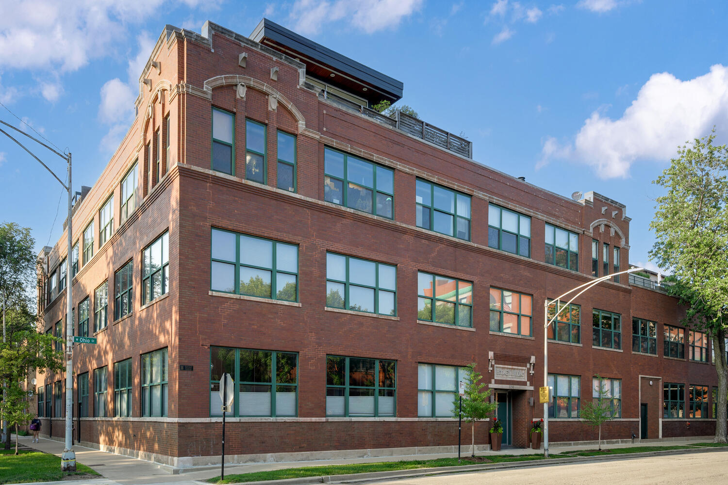 For the loft enthusiast who craves volume, texture, and soul - welcome to this rare West Town penthouse duplex with a serene, industrial-zen terrace and roof rights offering skyline views and endless possibilities. Once a manufacturing space, this true brick-and-timber loft blends raw industrial character with thoughtful, high-end upgrades. The expansive 1,200+ sq ft main level opens seamlessly to a beautifully landscaped deck designed by Brianne Bishop Design, creating a fluid indoor-outdoor living experience ideal for entertaining, relaxing, or creating. The custom kitchen is outfitted with GE Monogram and Viking appliances, including a 6-burner range, and rich wood cabinetry that warms the space. A flex room in the southwest corner can serve as a fourth bedroom, art studio, or home office. Downstairs, you'll find three bedrooms, including a spacious primary suite with walk-in closet and a tranquil bath with steam shower. Roof rights offer the opportunity for an additional structure or rooftop deck with sweeping skyline views. Two garage parking spaces included. A truly special home in one of West Town's most iconic boutique loft buildings.